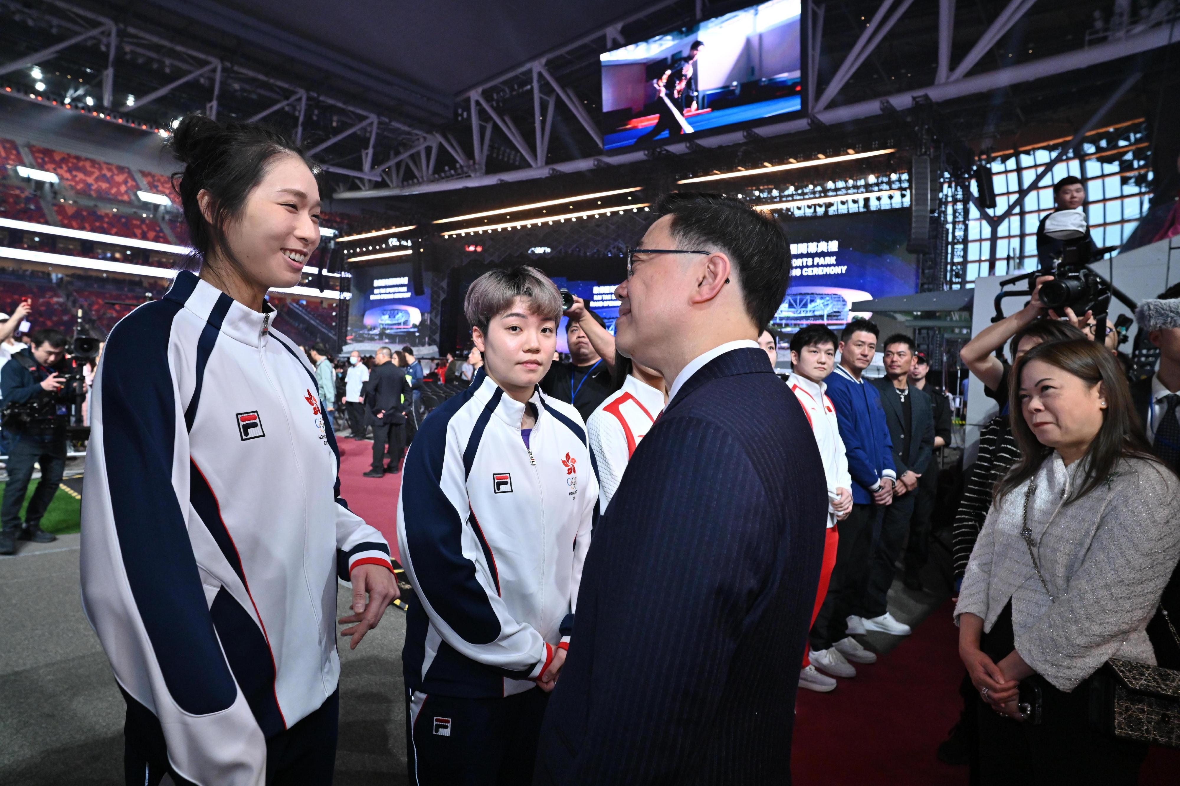 The Chief Executive, Mr John Lee, attended the Kai Tak Sports Park (KTSP) Grand Opening Ceremony today (March 1). Photo shows Mr Lee (second right) interacting with athletes at KTSP. Looking on is the Secretary for Culture, Sports and Tourism, Miss Rosanna Law (first right).
