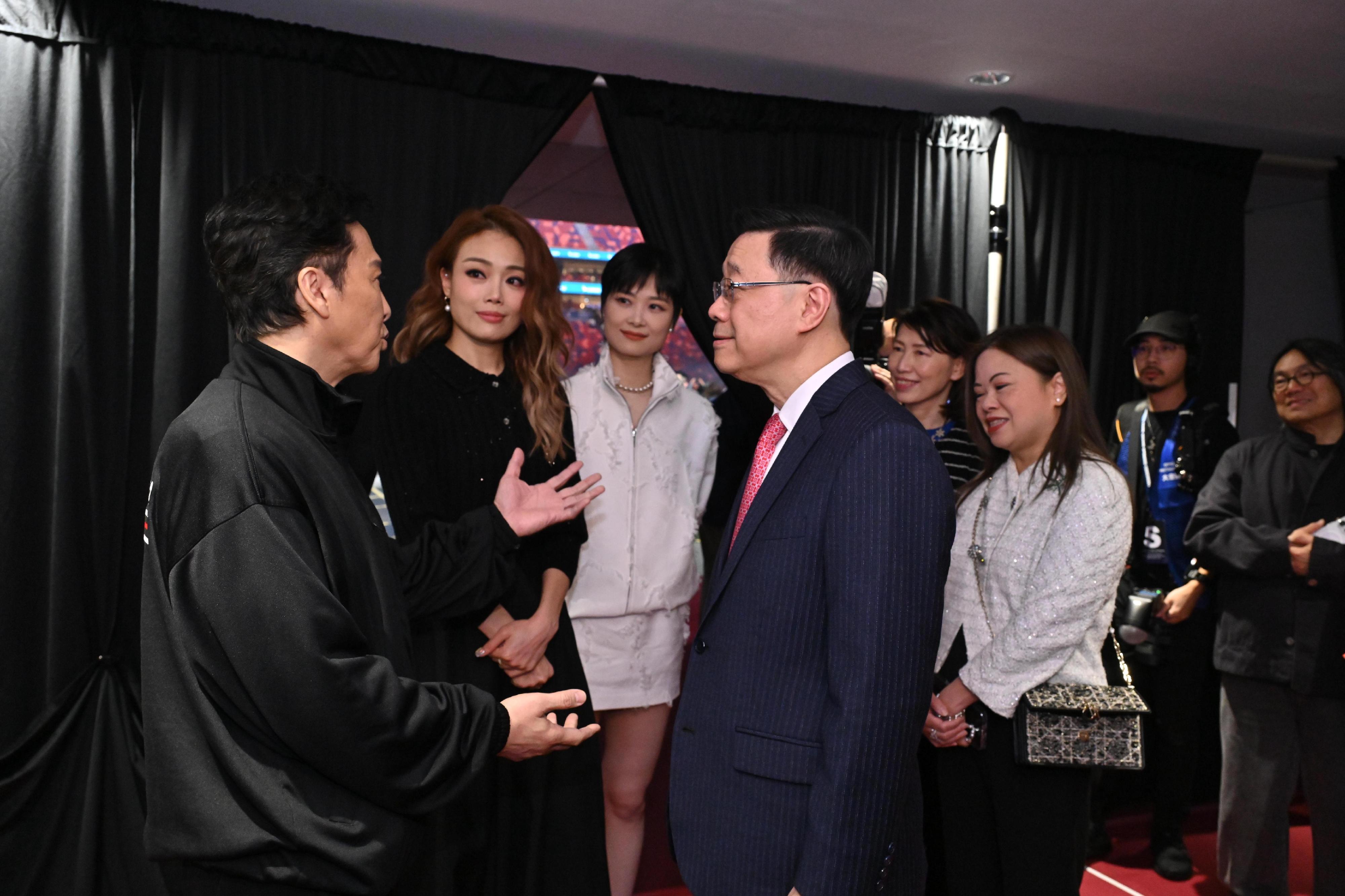 The Chief Executive, Mr John Lee, attended the Kai Tak Sports Park (KTSP) Grand Opening Ceremony today (March 1). Photo shows Mr Lee (fourth left) interacting with the performing artists at KTSP. Looking on is the Secretary for Culture, Sports and Tourism, Miss Rosanna Law (third right).
