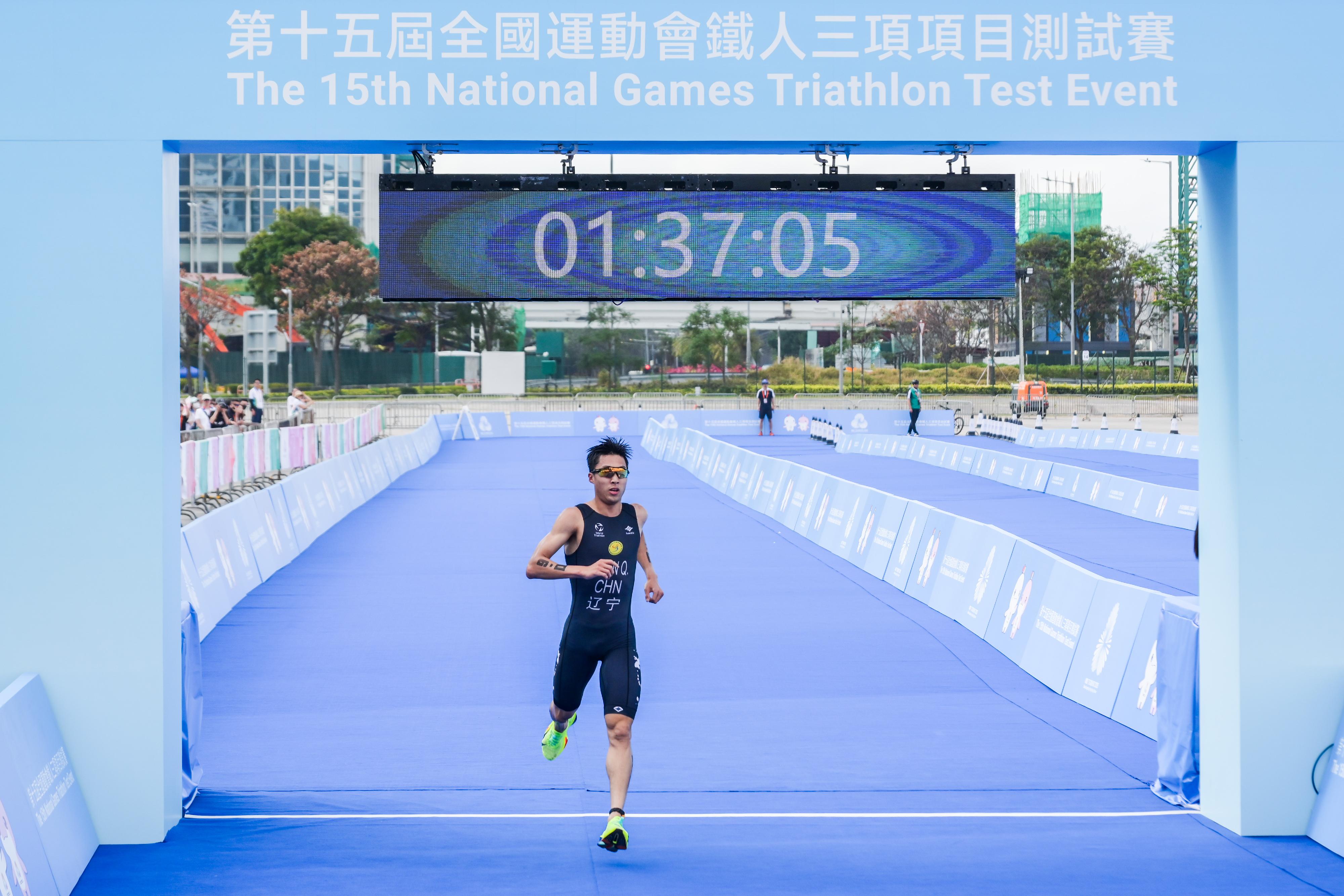 The mixed relay event of the 15th National Games Triathlon test event was held today (March 2) at the Central Harbourfront and Victoria Harbour. Photo shows an athlete finishing the event.