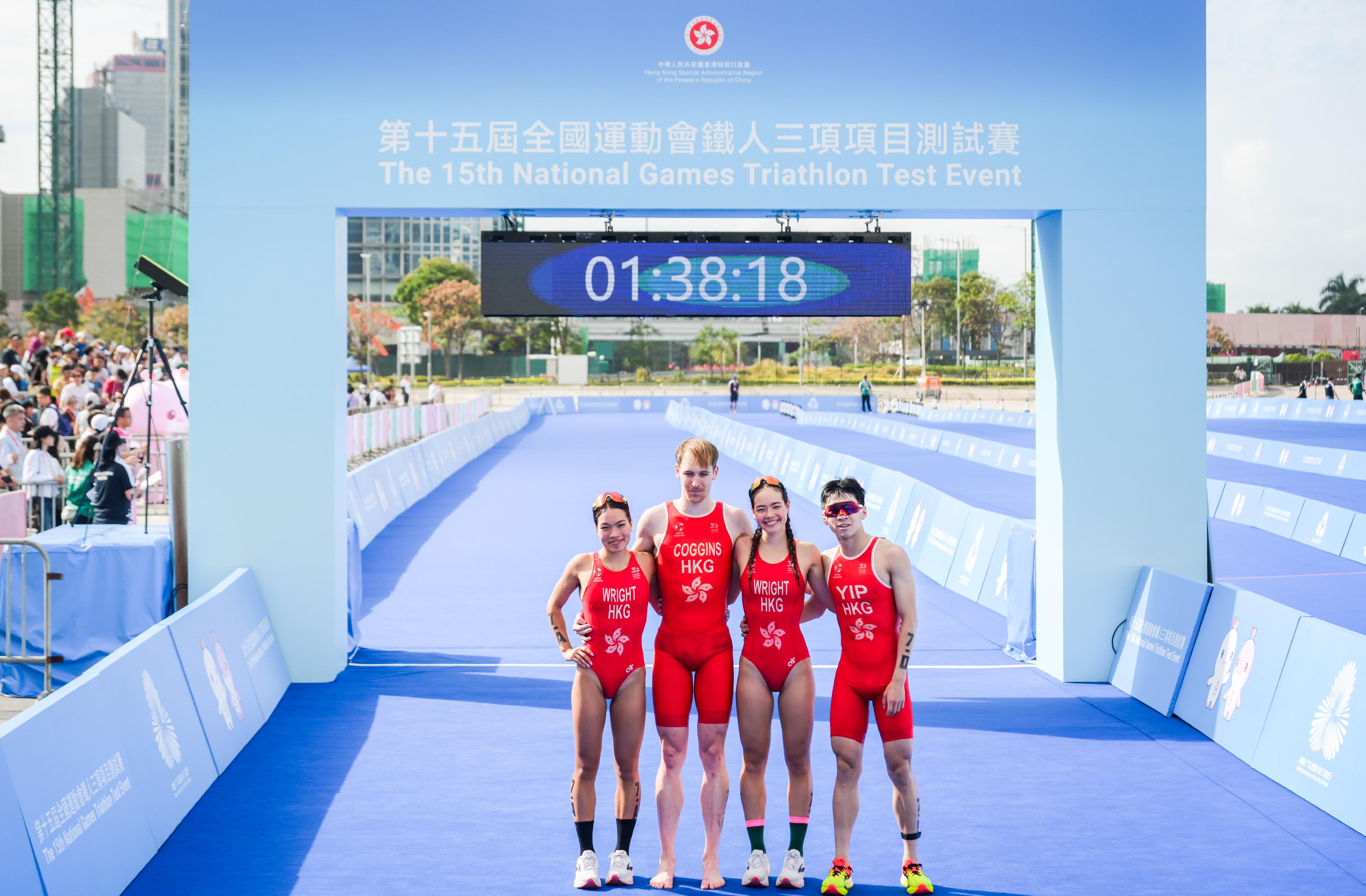 The mixed relay event of the 15th National Games Triathlon test event was held today (March 2) at the Central Harbourfront and Victoria Harbour. Photo shows athletes from the second runner-up team, Hong Kong team, taking a group photo after the race.