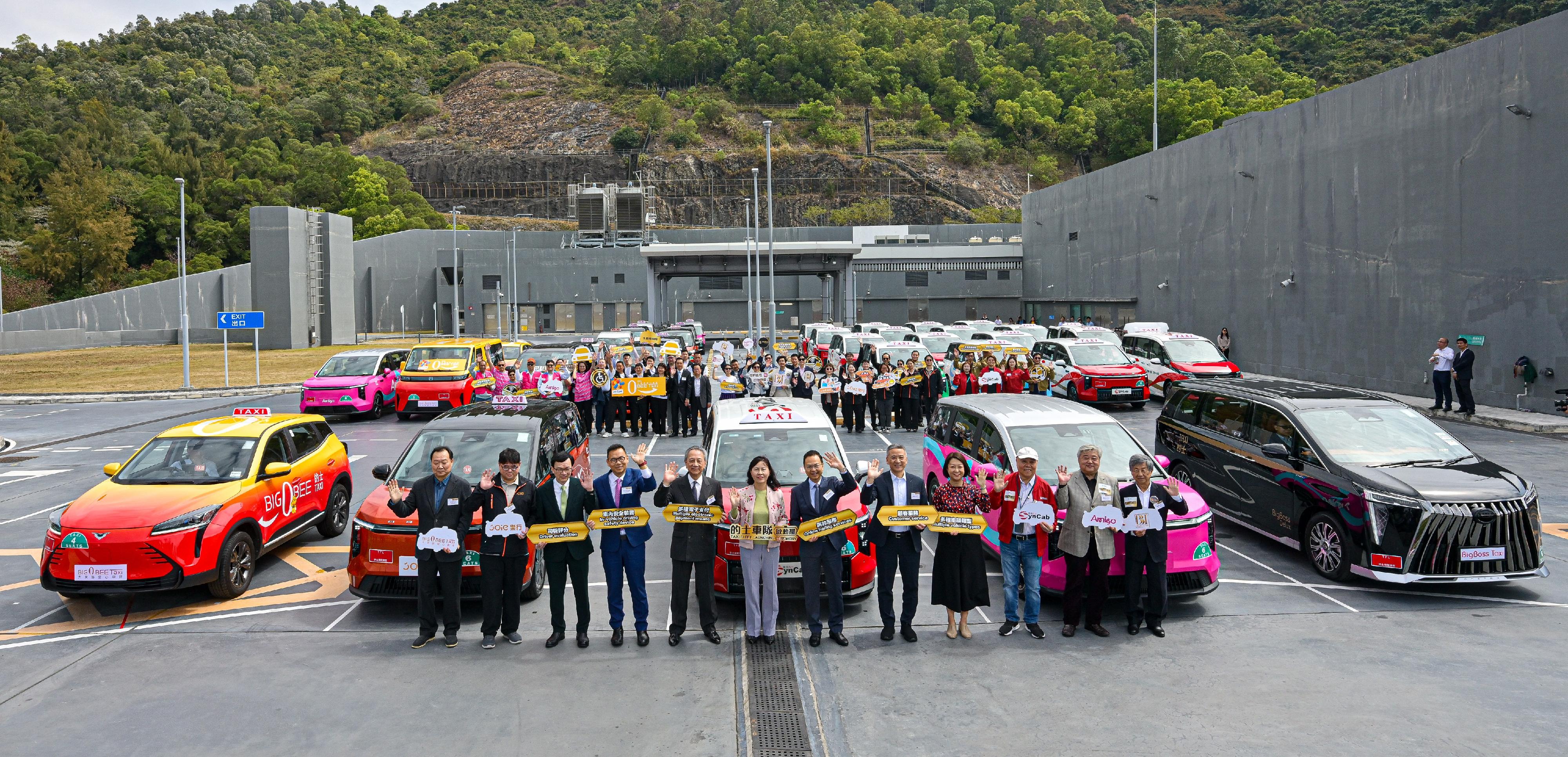 The Secretary for Transport and Logistics, Ms Mable Chan, today (March 3) attended the Taxi Fleet Launching Ceremony. The five selected taxi fleet operators will soon commence service gradually. Photo shows (front row, from third left) the Under Secretary for Transport and Logistics, Mr Liu Chun-san; Legislative Council (LegCo) Member Dr Chan Han-pan; LegCo Member (Transport) Mr Frankie Yick; Ms Chan; the Chairman of the LegCo Panel on Transport, Mr Chan Siu-hung; the Deputy Chairman of the LegCo Panel on Transport, Mr Yiu Pak-leung; the Commissioner for Transport, Ms Angela Lee; representatives of taxi fleet operators and their teams.