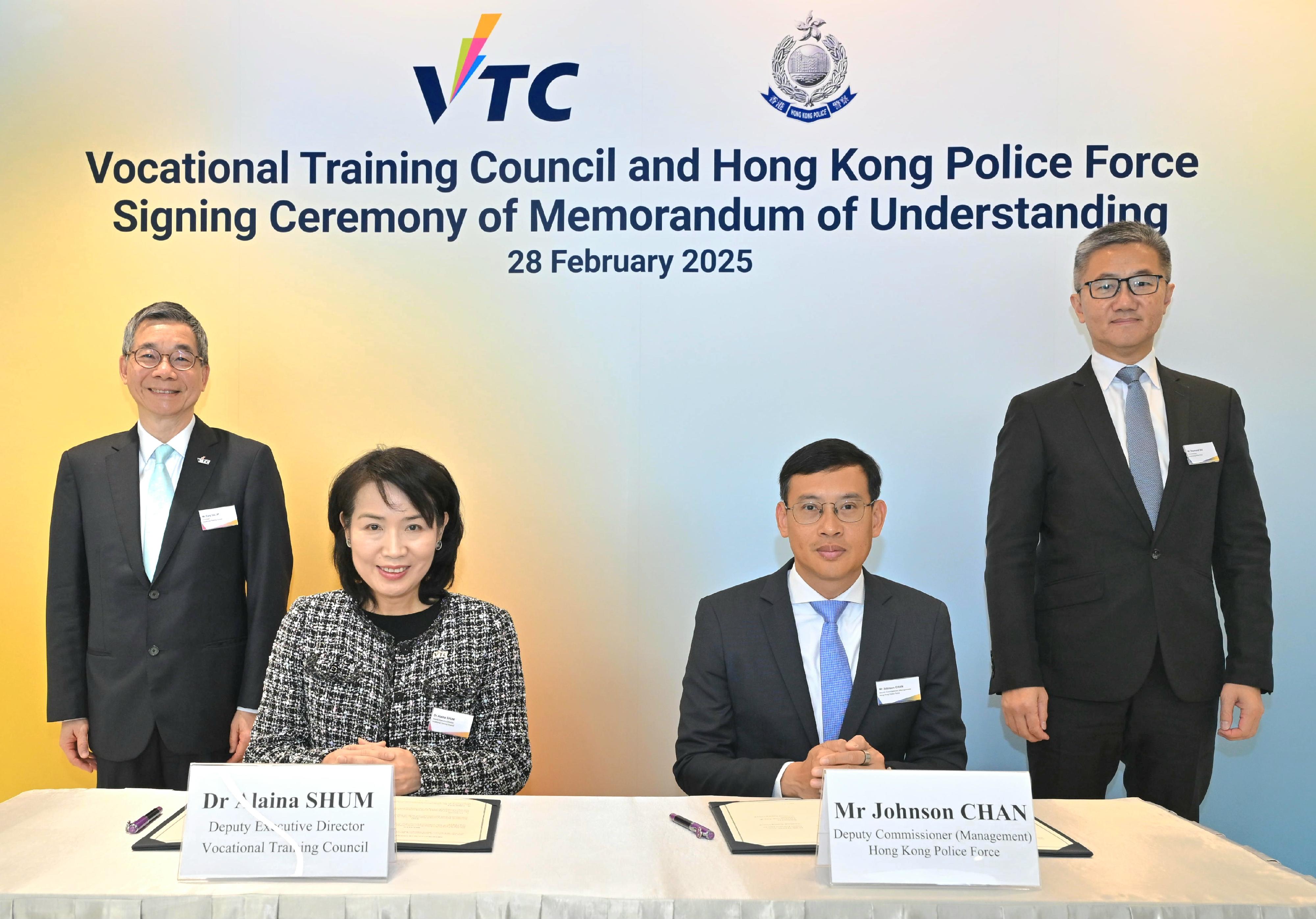 The Hong Kong Police Force and the Vocational Training Council (VTC) signed a Memorandum of Understanding (MOU) on February 28 to enhance the professional training of police officers and support young people in developing their vocational plans. Photo shows the Commissioner of Police, Mr Siu Chak-yee (back row, right) and the Chairman of VTC, Mr Tony Tai (back row, left), witnessing the signing of the MOU between the Deputy Commissioner of Police (Management), Mr Chan Joon-sun (front row, right) and the Deputy Executive Director of VTC, Dr Alaina Shum (front row, left).