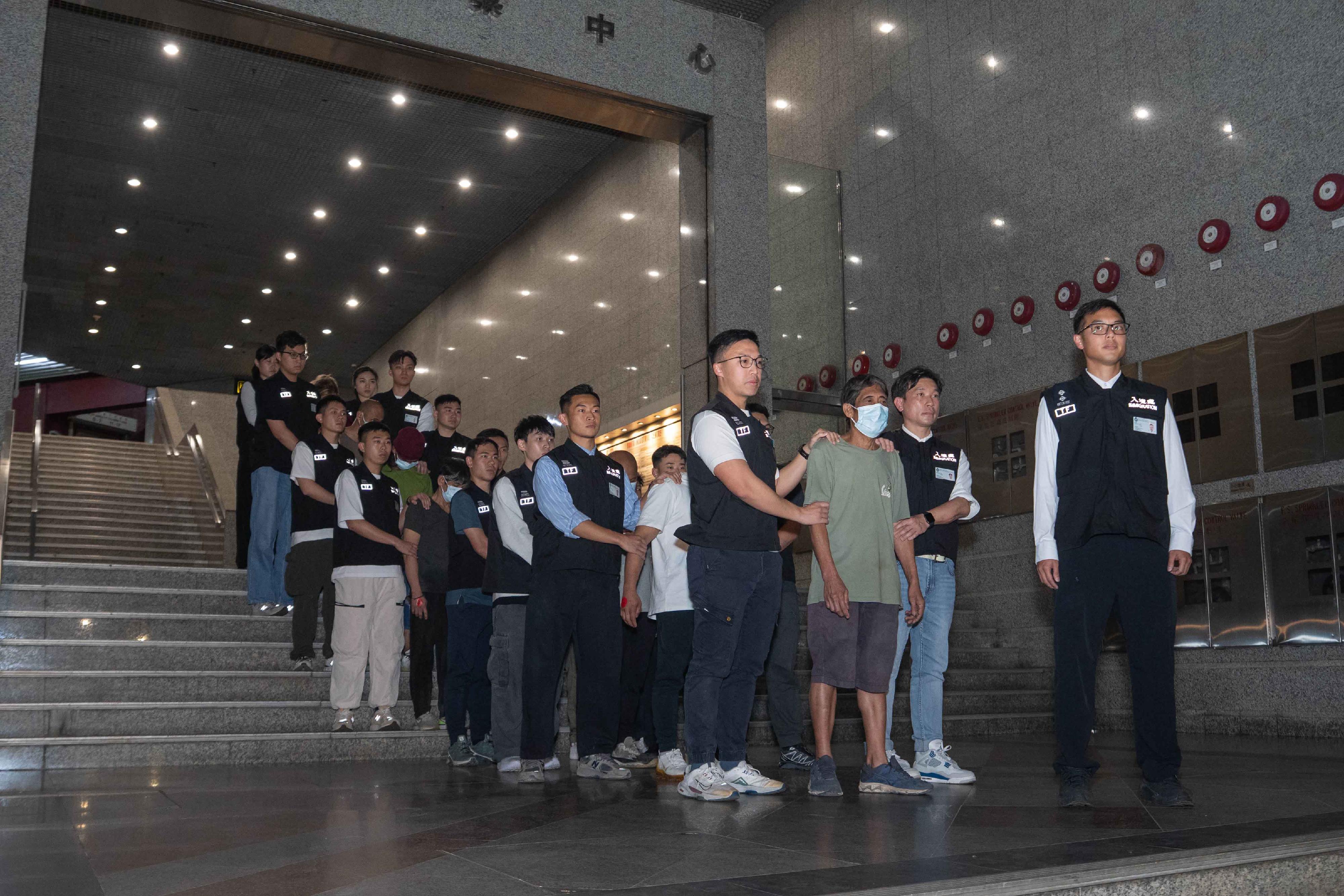 The Immigration Department mounted an anti-illegal worker operation in Kwai Chung on March 4. A total of eight suspected illegal workers and one suspected employer were arrested. Photo shows the suspected illegal workers arrested during the operation.
