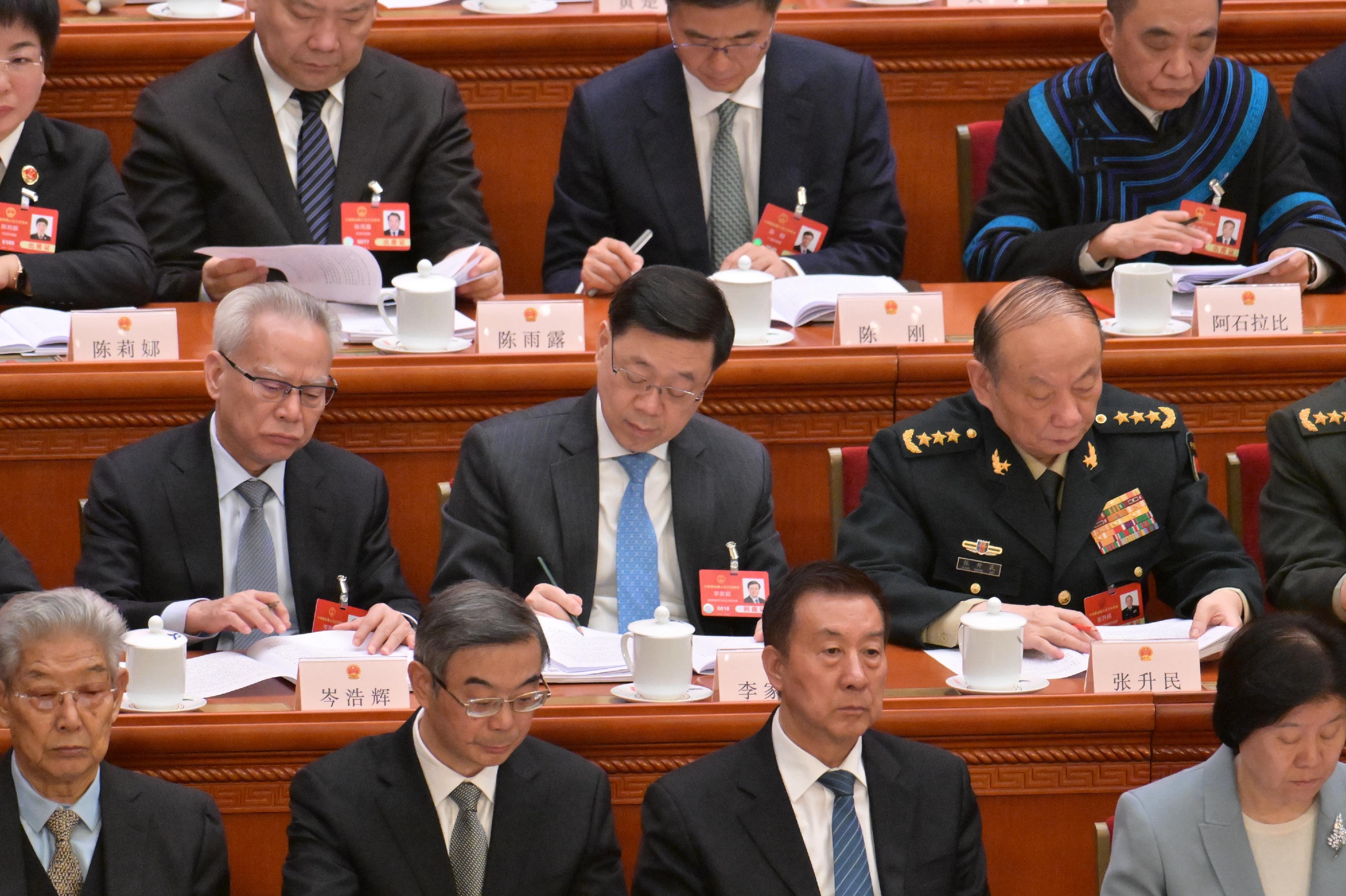 The Chief Executive, Mr John Lee (second row, centre), attends the opening meeting of the third annual session of the 14th National People's Congress in Beijing today (March 5).
