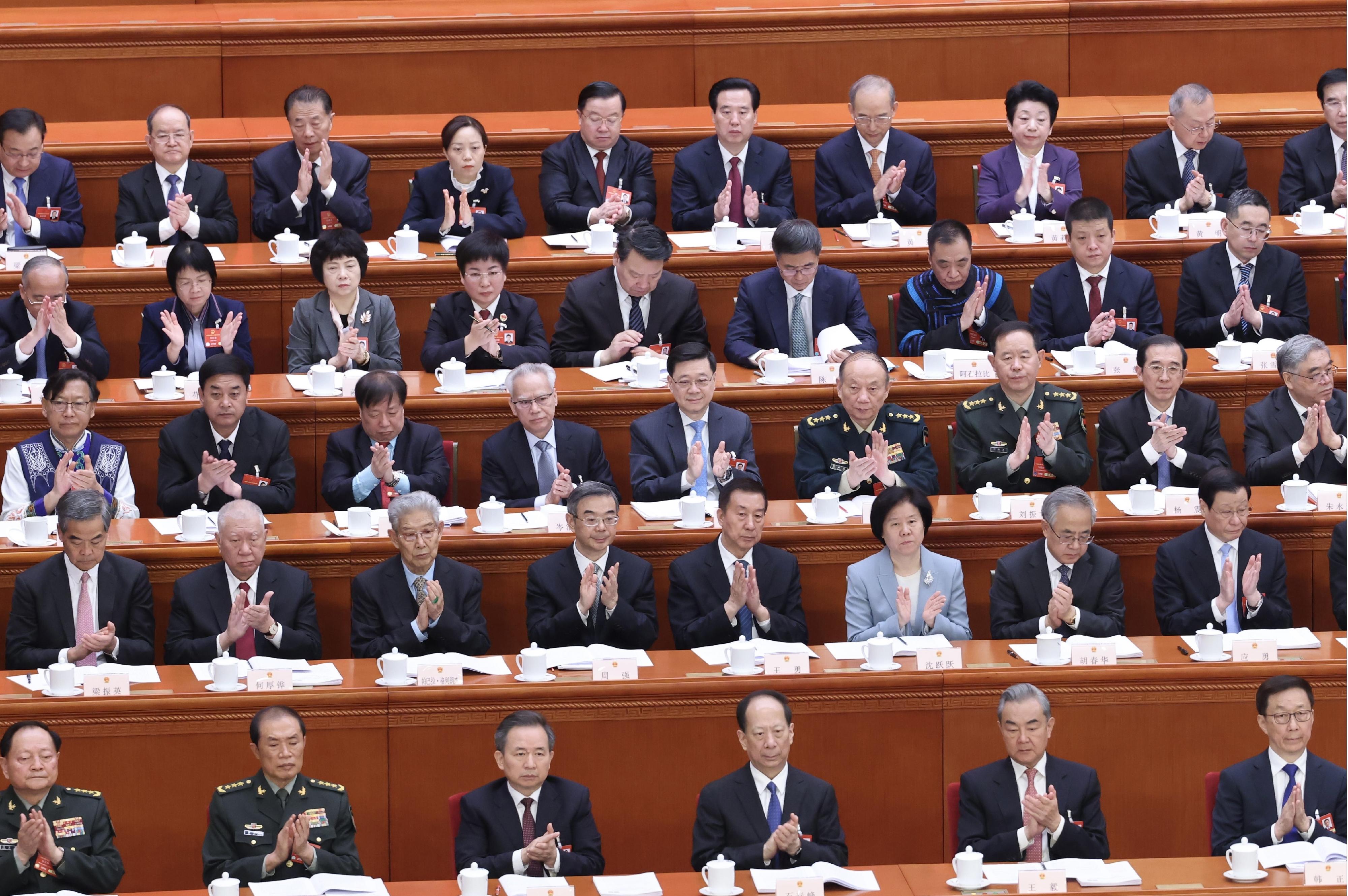 The Chief Executive, Mr John Lee (third row, centre), attends the opening meeting of the third annual session of the 14th National People's Congress in Beijing today (March 5).