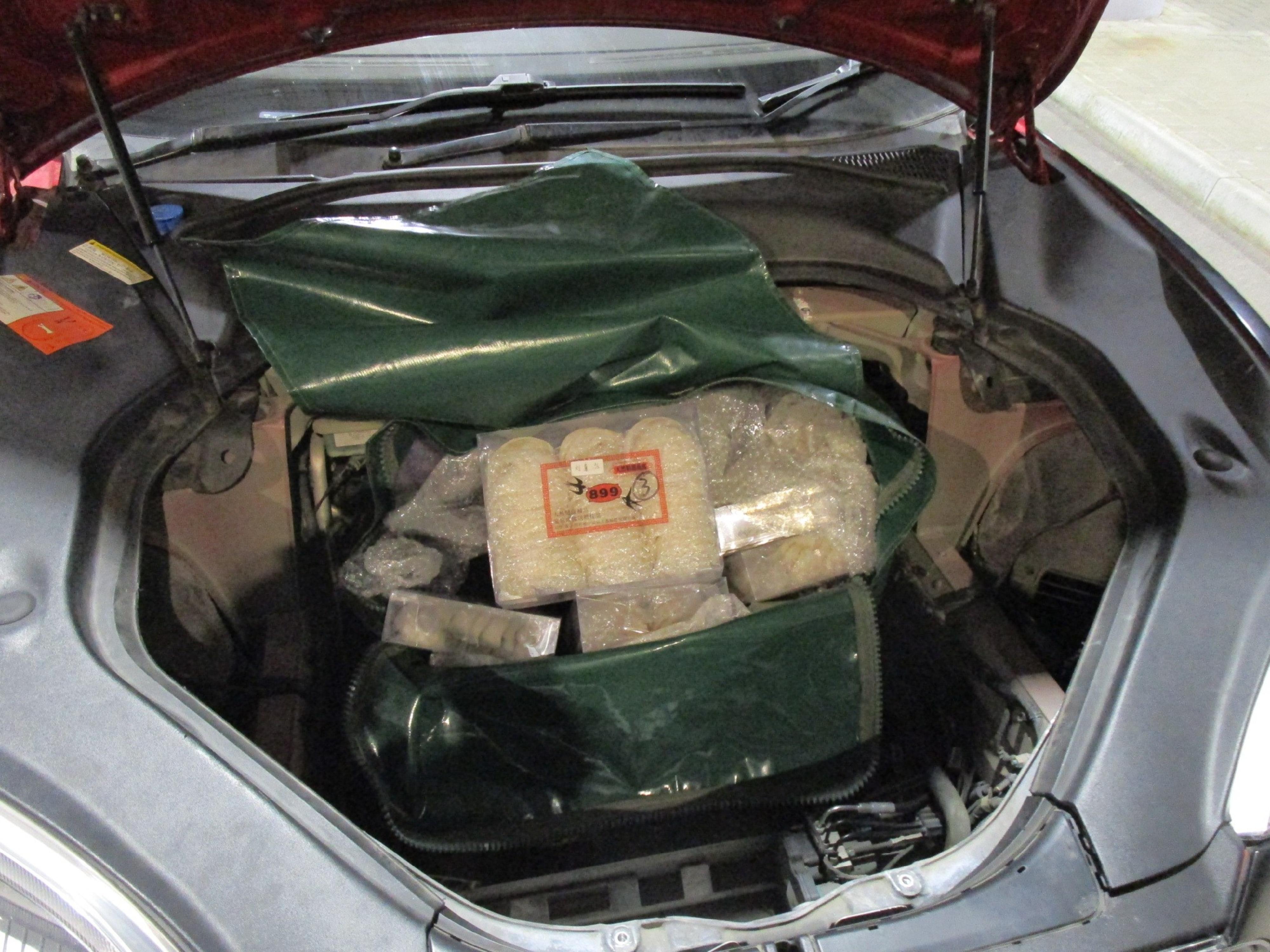 Hong Kong Customs on February 20 detected a suspected smuggling case involving an outgoing cross-boundary private car at the Hong Kong-Zhuhai-Macao Bridge Hong Kong Port and seized about 24 kilograms of suspected smuggled bird's nests and about 43kg of suspected scheduled fish maw, with a total estimated market value of about $5.2 million. Photo shows the suspected smuggled bird's nests concealed beneath the front trunk of the vehicle.