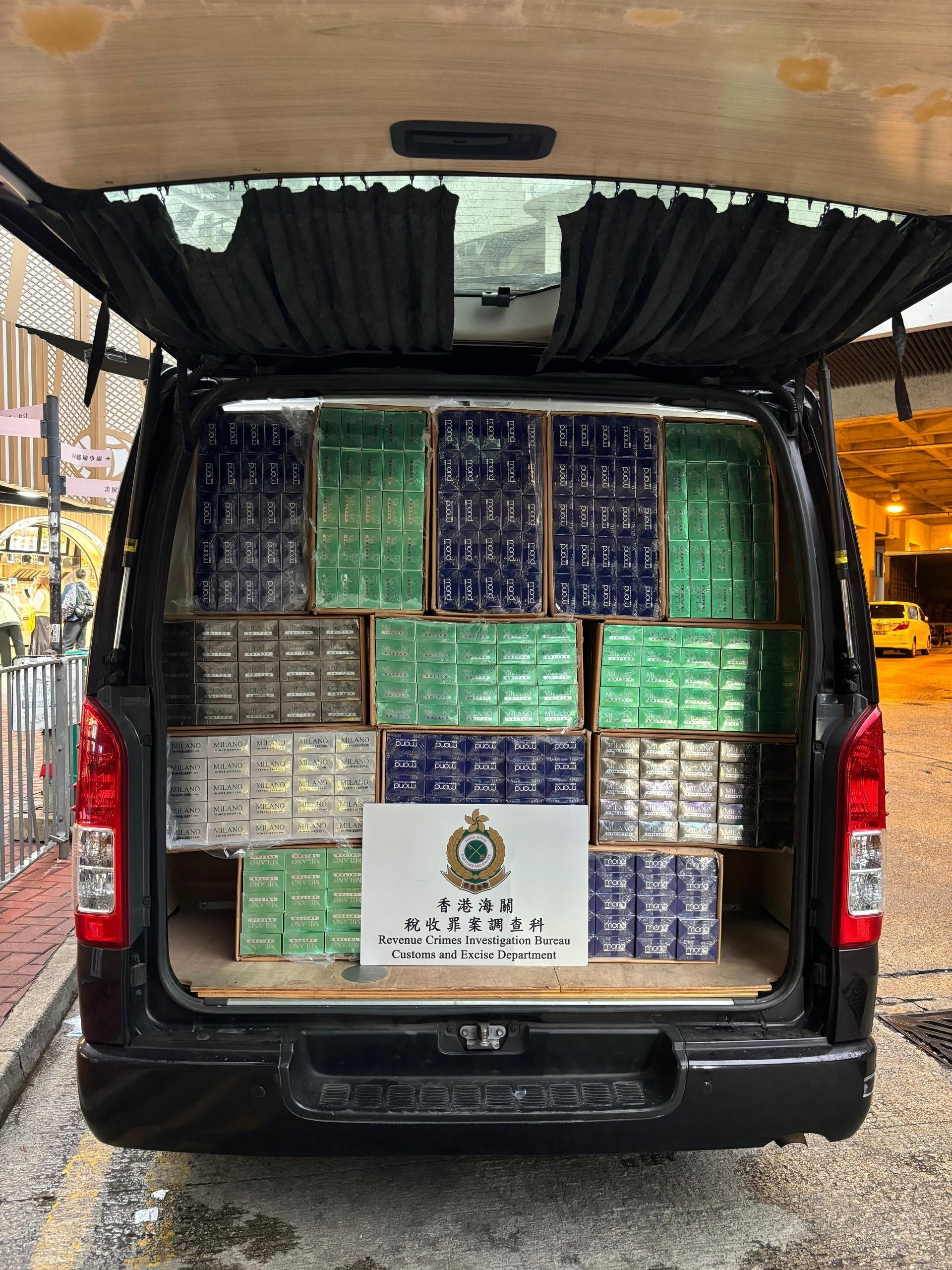 Hong Kong Customs yesterday (March 5) raided suspected illicit cigarette mobile storage centres in Yuen Long and seized about 1.03 million suspected illicit cigarettes with an estimated market value of about $4.6 million and a duty potential of about $3.4 million. Among them, about 1.02 million of the seized illicit cigarettes were "cheap whites", accounting for about 99 per cent of the total seizure. Photo shows one of the vehicles suspected to be used for storing and distributing illicit cigarettes. 