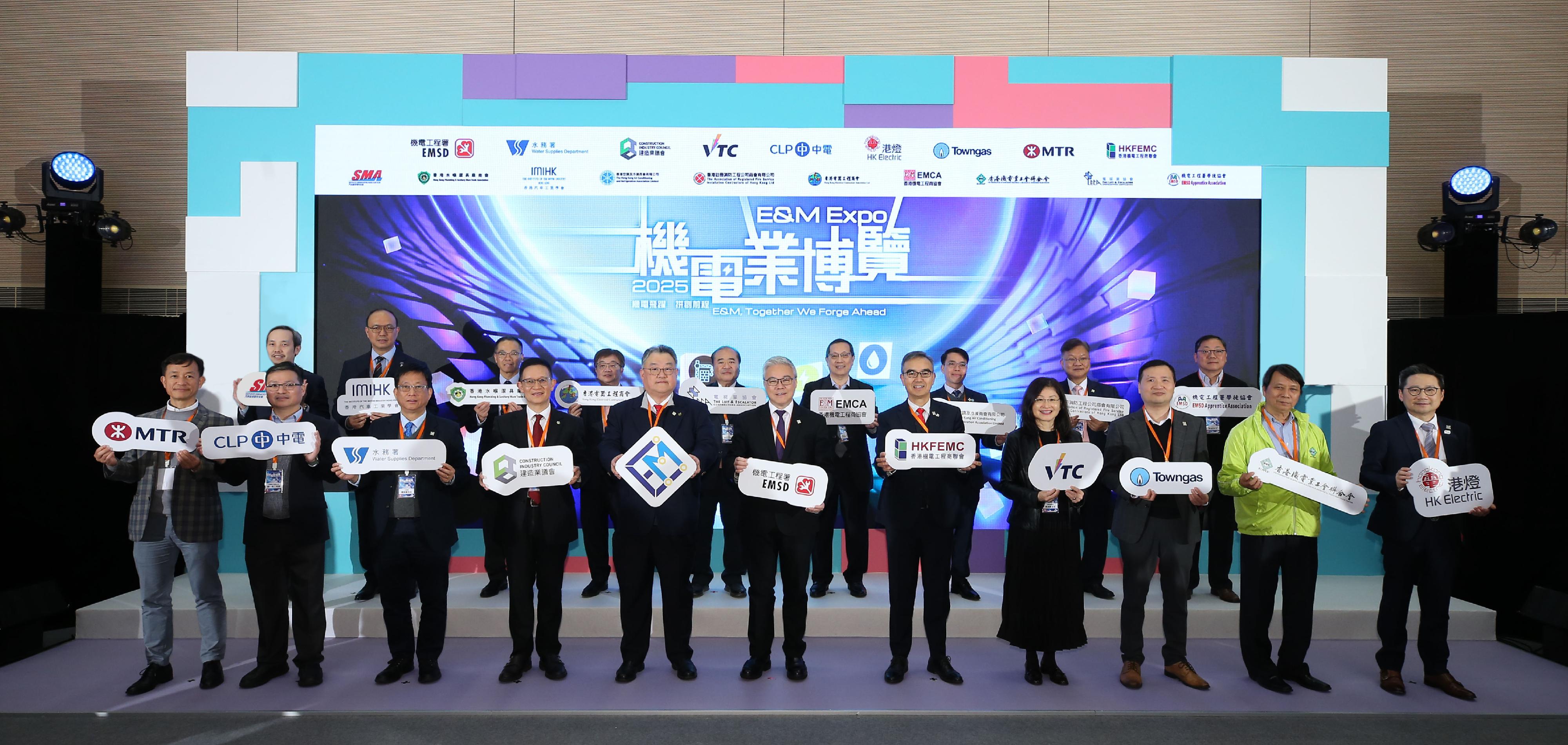 The Electrical and Mechanical Services Department and the Hong Kong Electrical and Mechanical Trade Promotion Working Group today (March 7) jointly held the Electrical and Mechanical Expo 2025. Photo shows the Director of Electrical and Mechanical Services, Mr Poon Kwok-ying (front row, centre), the representative of the Hong Kong Electrical and Mechanical Trade Promotion Working Group and President of the Hong Kong Federation of Electrical and Mechanical Contractors Limited, Mr Emil Yu (front row, fifth left), and other representatives of the Working Group officiating at the opening ceremony.