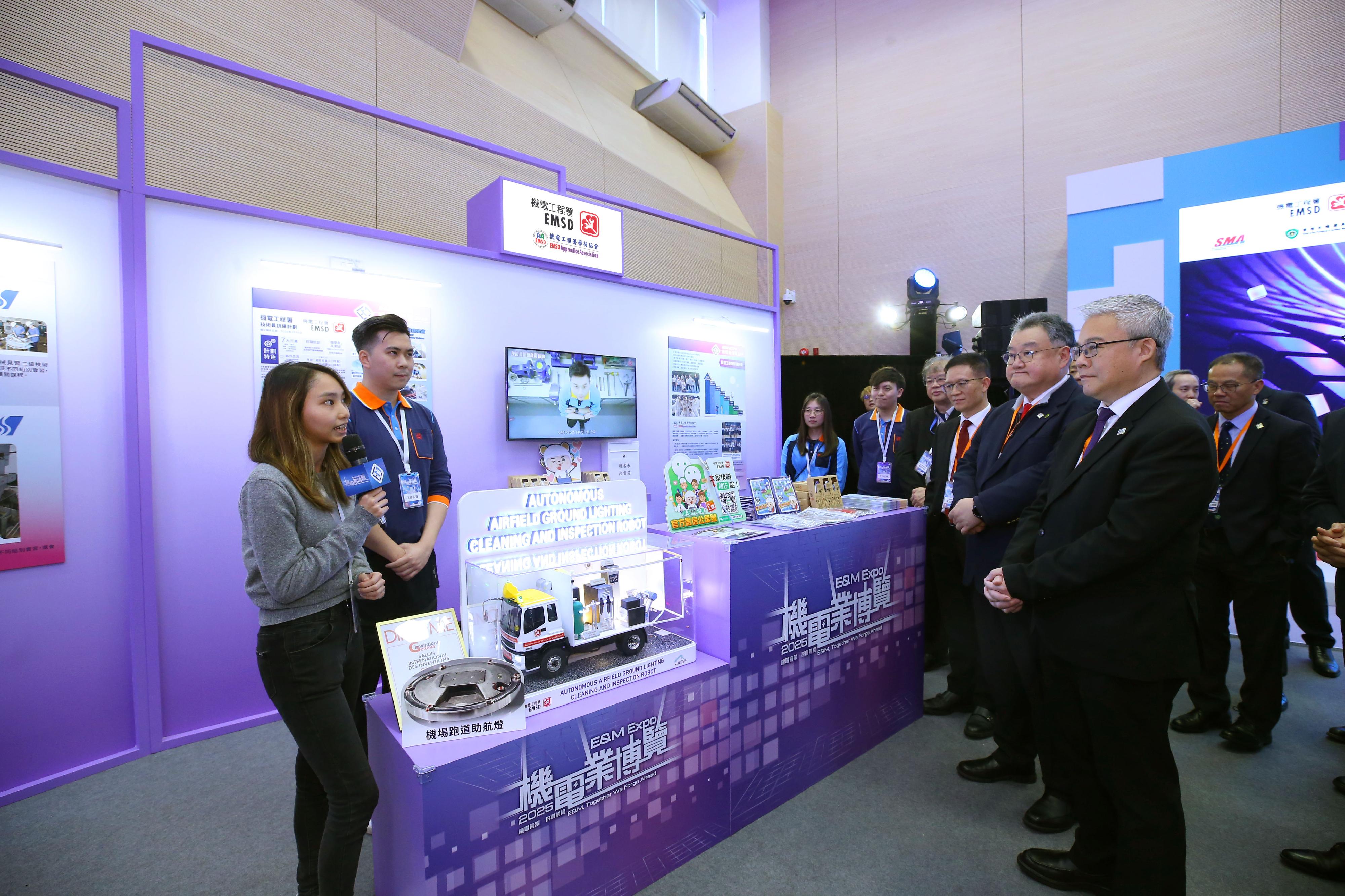 The Electrical and Mechanical Services Department and the Hong Kong Electrical and Mechanical Trade Promotion Working Group today (March 7) jointly held the Electrical and Mechanical Expo 2025. Photo shows the Director of Electrical and Mechanical Services, Mr Poon Kwok-ying (first right), and the representative of the Hong Kong Electrical and Mechanical Trade Promotion Working Group and President of the Hong Kong Federation of Electrical and Mechanical Contractors Limited, Mr Emil Yu (second right), visiting an exhibition booth.