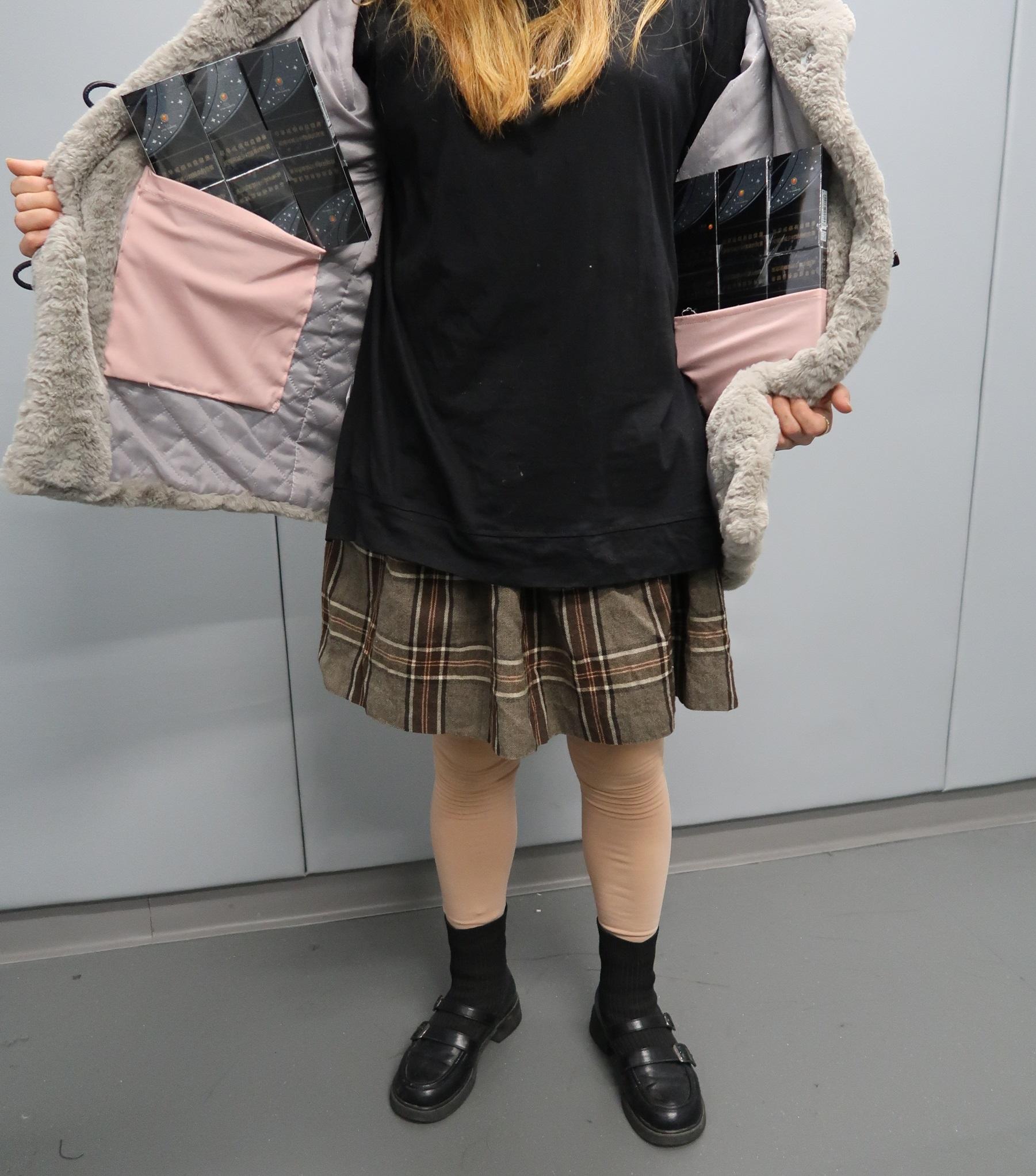 An incoming female passenger was sentenced to two months' imprisonment and fined $2,000 at the Fanling Magistrates' Courts today (March 7) for possession of duty-not-paid cigarettes and failing to declare to Customs Officers, in contravention of the Dutiable Commodities Ordinance. Photo shows the duty-not-paid cigarettes seized from a tailor-made jacket worn by the female passenger.


	

