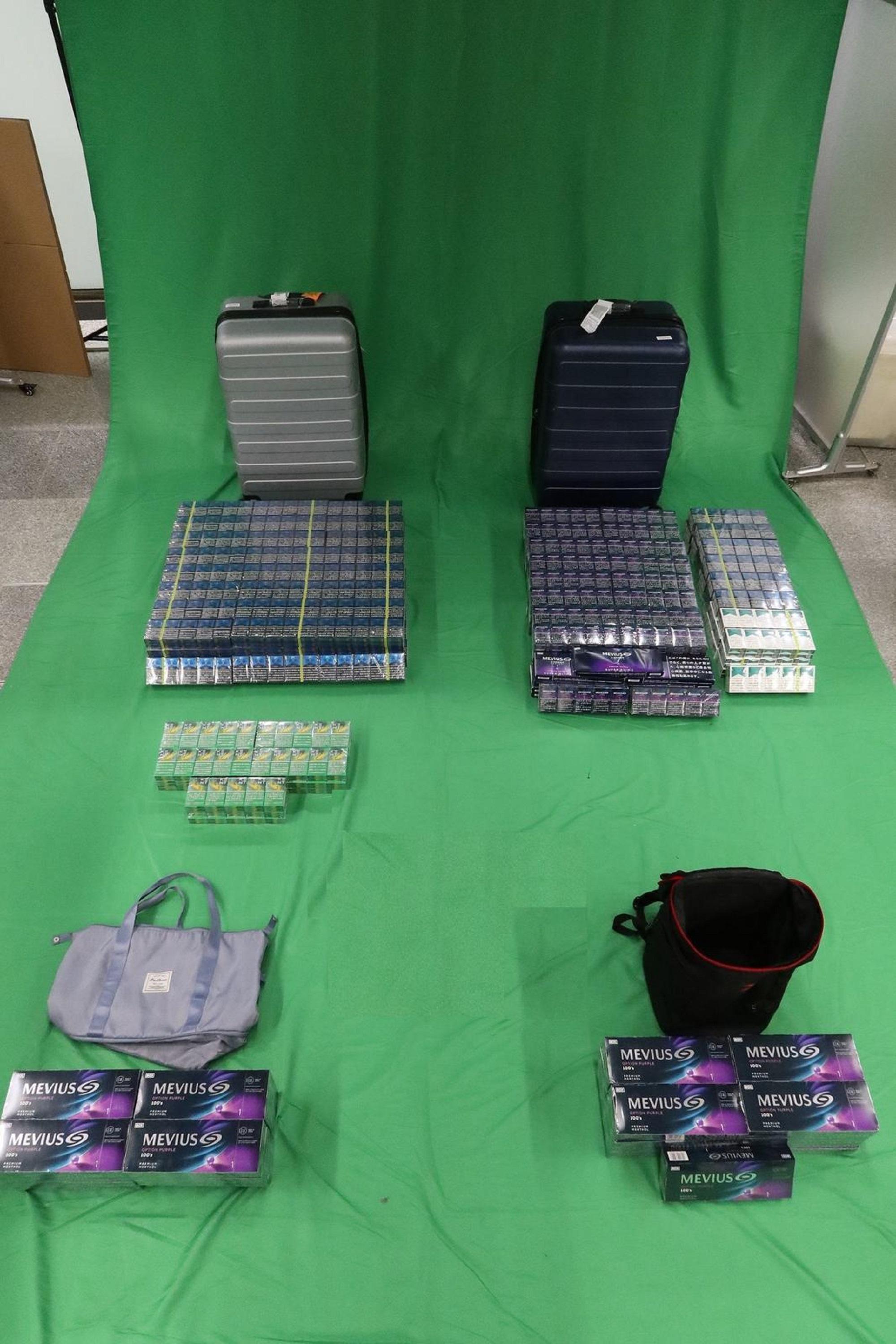 An incoming male passenger was sentenced to six months' imprisonment and fined at the Kowloon City Magistrates' Courts yesterday (March 8) for dealing with duty-not-paid cigarettes and failing to declare to Customs Officers, in contravention of the Dutiable Commodities Ordinance. Photo shows the duty-not-paid cigarettes seized.