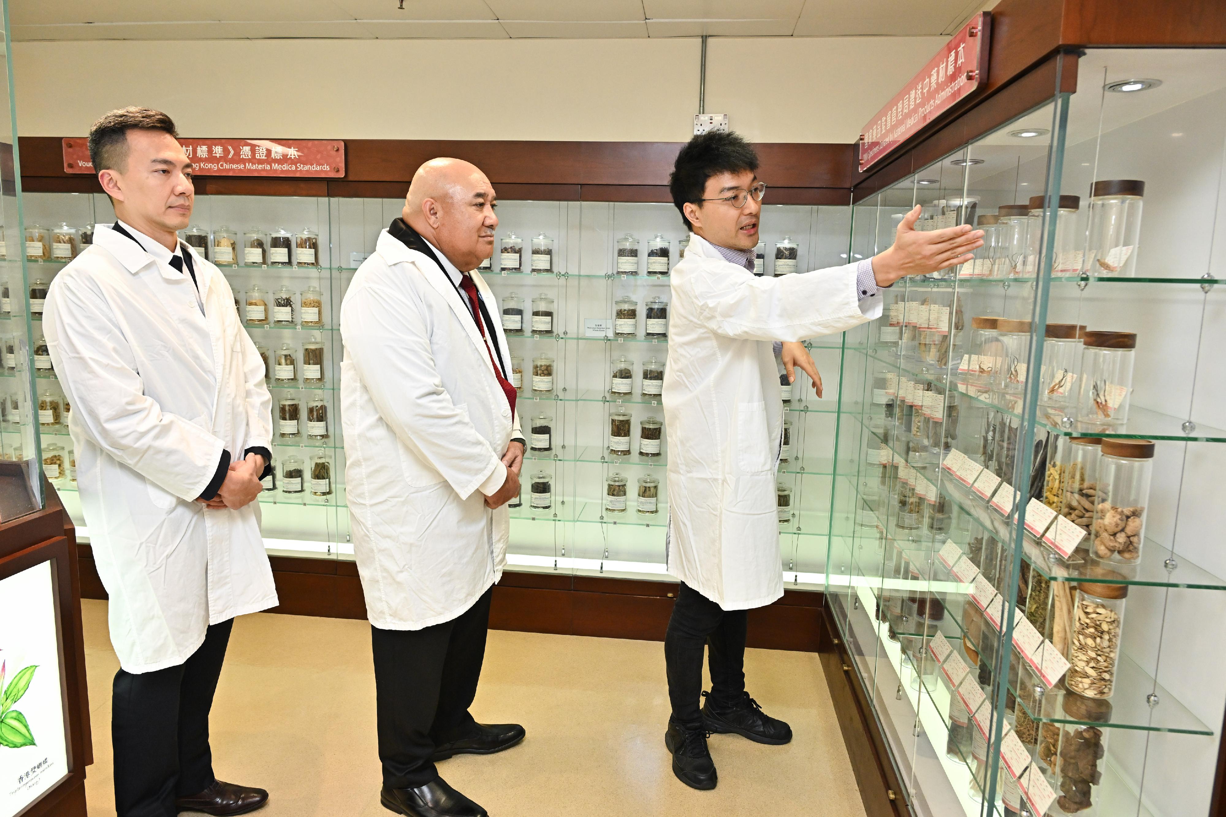 The World Health Organization Regional Director for the Western Pacific, Dr Saia Ma'u Piukala, visited the Department of Health (DH) today (March 11) to gain insights into its pioneering efforts in advancing global public health, prevention and control of infectious diseases, traditional Chinese Medicine development and effective implementation of tobacco control strategies. Photo shows Dr Saia Ma'u Piukala (centre), accompanied by the Assistant Director (Chinese Medicine), Dr Edmund Fong (left), visiting the Government Chinese Medicines Testing Institute of the DH.