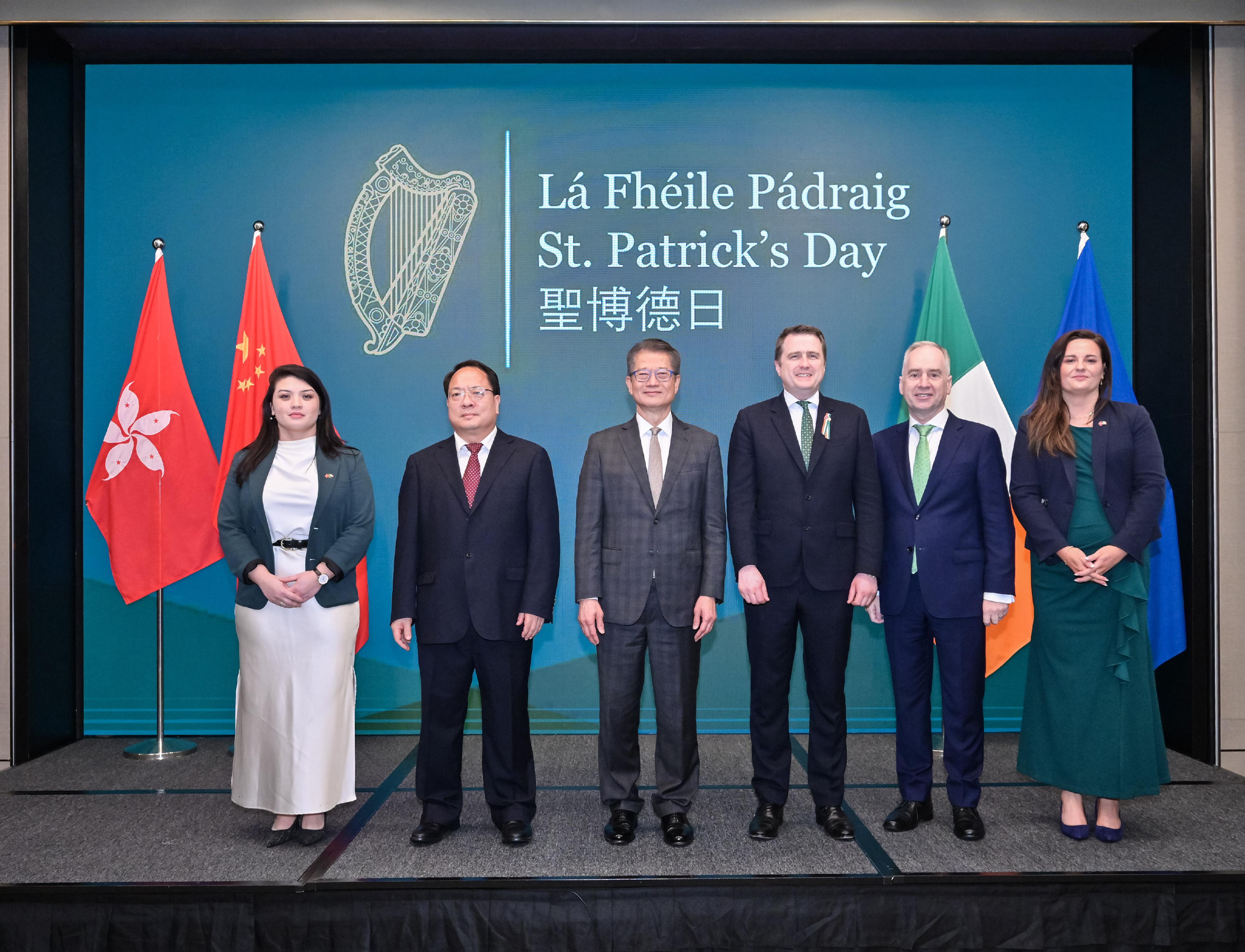 The Financial Secretary, Mr Paul Chan, attended Ireland's National Day Reception today (March 13). Photo shows Mr Chan (third left); the Minister for Housing, Local Government and Heritage of Ireland, Mr James Browne (third right); the Ambassador of Ireland to China, Dr Nicholas O’Brien (second right); the Consul General of Ireland to Hong Kong and Macao, Ms Jennifer Bourke (first right); Deputy Commissioner of the Office of the Commissioner of the Ministry of Foreign Affairs of the People's Republic of China in the Hong Kong Special Administrative Region Mr Pan Yundong (second left), and other guest at the reception.