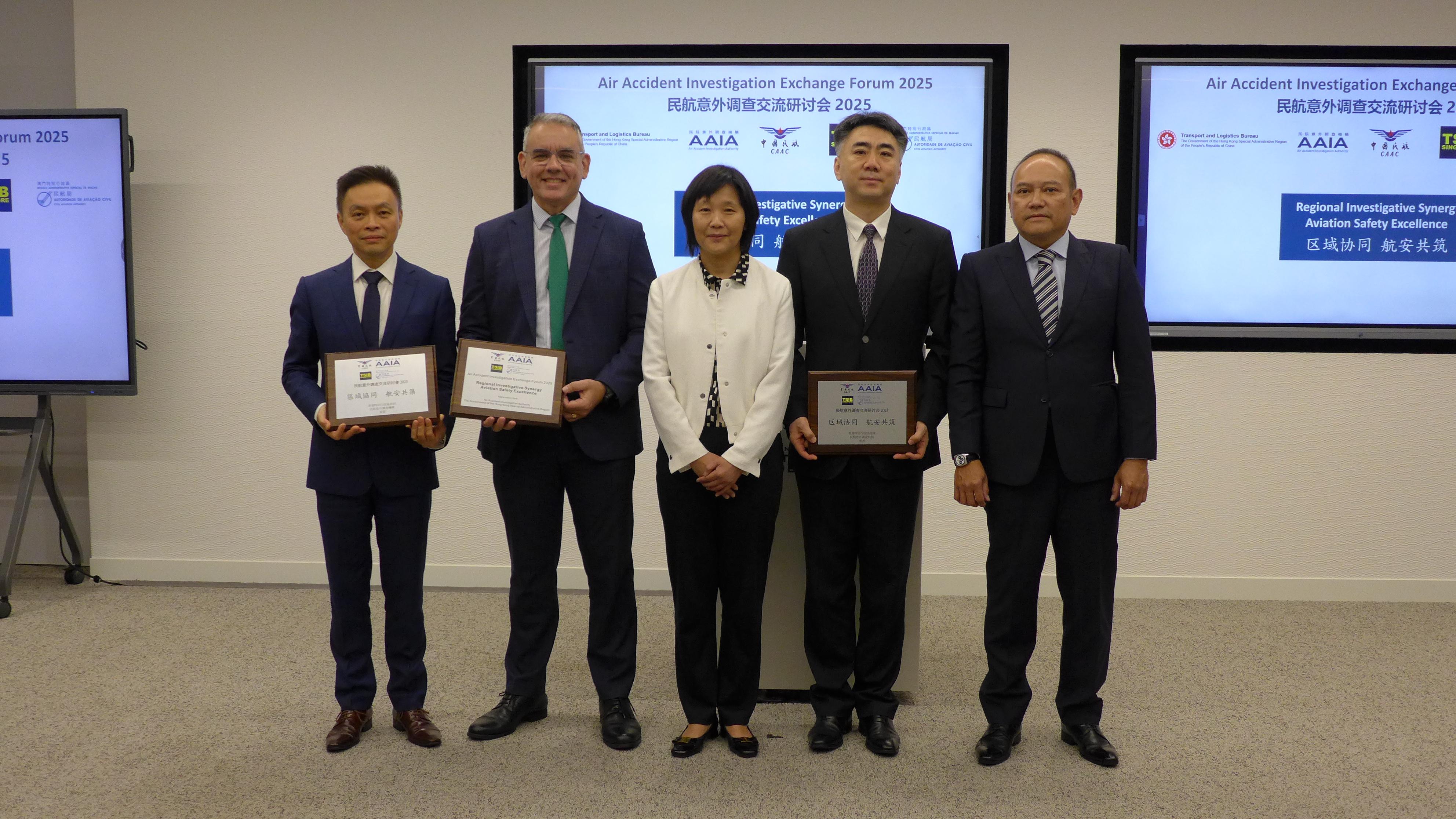 The Air Accident Investigation Authority (AAIA) hosted the Air Accident Investigation Exchange Forum 2025 in Hong Kong for three consecutive days from March 12. Photo shows the Safety Oversight Commissioner of the Civil Aviation Administration of China (CAAC) and Director of the CAAC Office of Aviation Safety, Captain Zhu Tao (second right); the Director of Transport Safety Investigation Bureau of Singapore, Mr Michael Toft (second left); the President of the Civil Aviation Authority of the Macao Special Administrative Region, Mr Stanley Pun (first left); Deputy Secretary for Transport and Logistics Ms Joan Hung (centre); and the Chief Accident and Safety Investigator of the AAIA, Mr Man Ka-chai (first right), at the forum.
