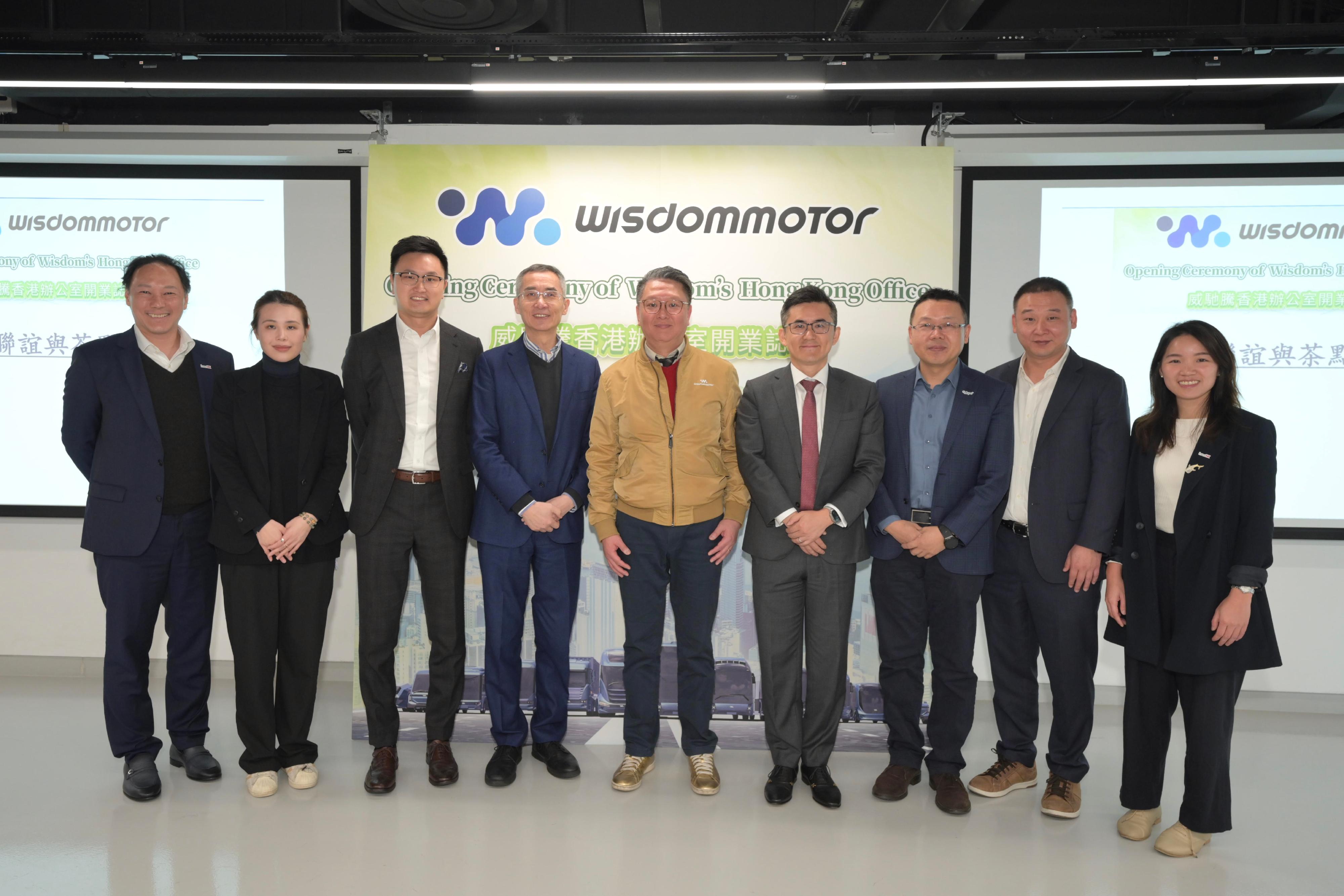 Invest Hong Kong (InvestHK) announced that Wisdom Motor, a leading manufacturer of zero-emission commercial vehicles, officially opened its global headquarters in Hong Kong today (March 18), tapping into the growing demand for sustainable transportation solutions in the region and enhancing collaboration with local partners. Photo shows (from left) the Global Head of Financial Services, Fintech and Sustainability at InvestHK, Mr King Leung; Board Secretary of Wisdom (Fujian) Motor Co Ltd, Ms Lexie Lin; Partner of Templewater Hong Kong Limited and Director of WSD Holdings (HK) Limited, Mr Alfred Wong; Chief Executive Officer and Executive Director of Hans Group Holdings Limited, Mr Yang Dong; President of WSD Holdings (HK) Limited, Mr Tay Cheong Lip; Partner of Templewater Hong Kong Limited and Director of WSD Holdings (HK) Limited, Dr Wan Yufeng; Chief Innovation Officer of the Hong Kong Productivity Council, Mr Du Yonghai; Chief Strategy Officer of Wisdom Sales (HK) Limited, Mr Felix Xu; and Senior Vice President, (Sustainability) for Technology, Innovation and Entrepreneurship at InvestHK, Ms Olivia To. 