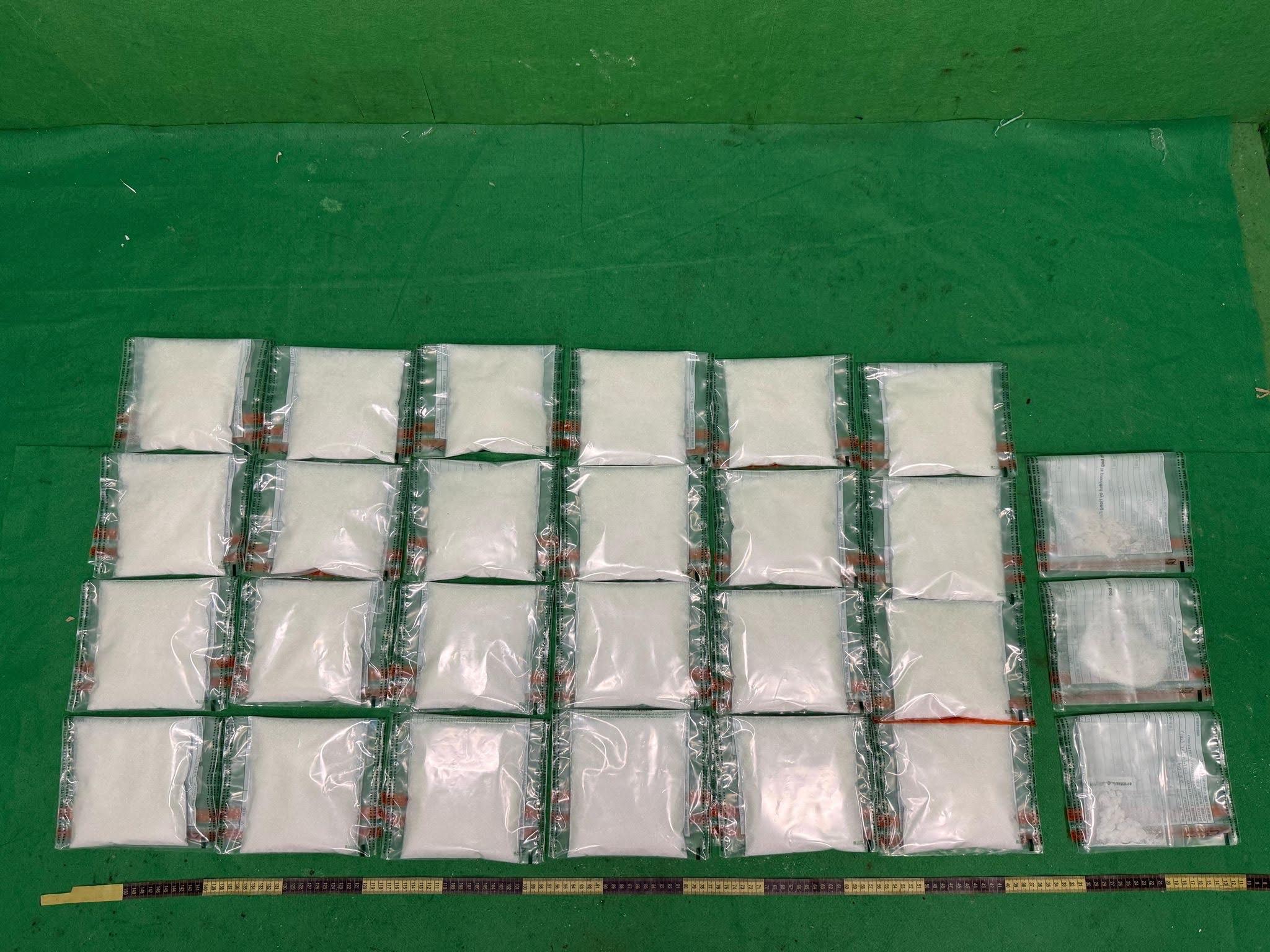 Hong Kong Customs on March 11 and yesterday (March 17) seized a total of about 6 kilograms of suspected ketamine and about 8 grams of suspected methamphetamine, with an estimated market value of over $2.8 million, at Hong Kong International Airport and in Kwai Chung. Photo shows the suspected ketamine concealed inside packaging boxes of bottle openers. 

