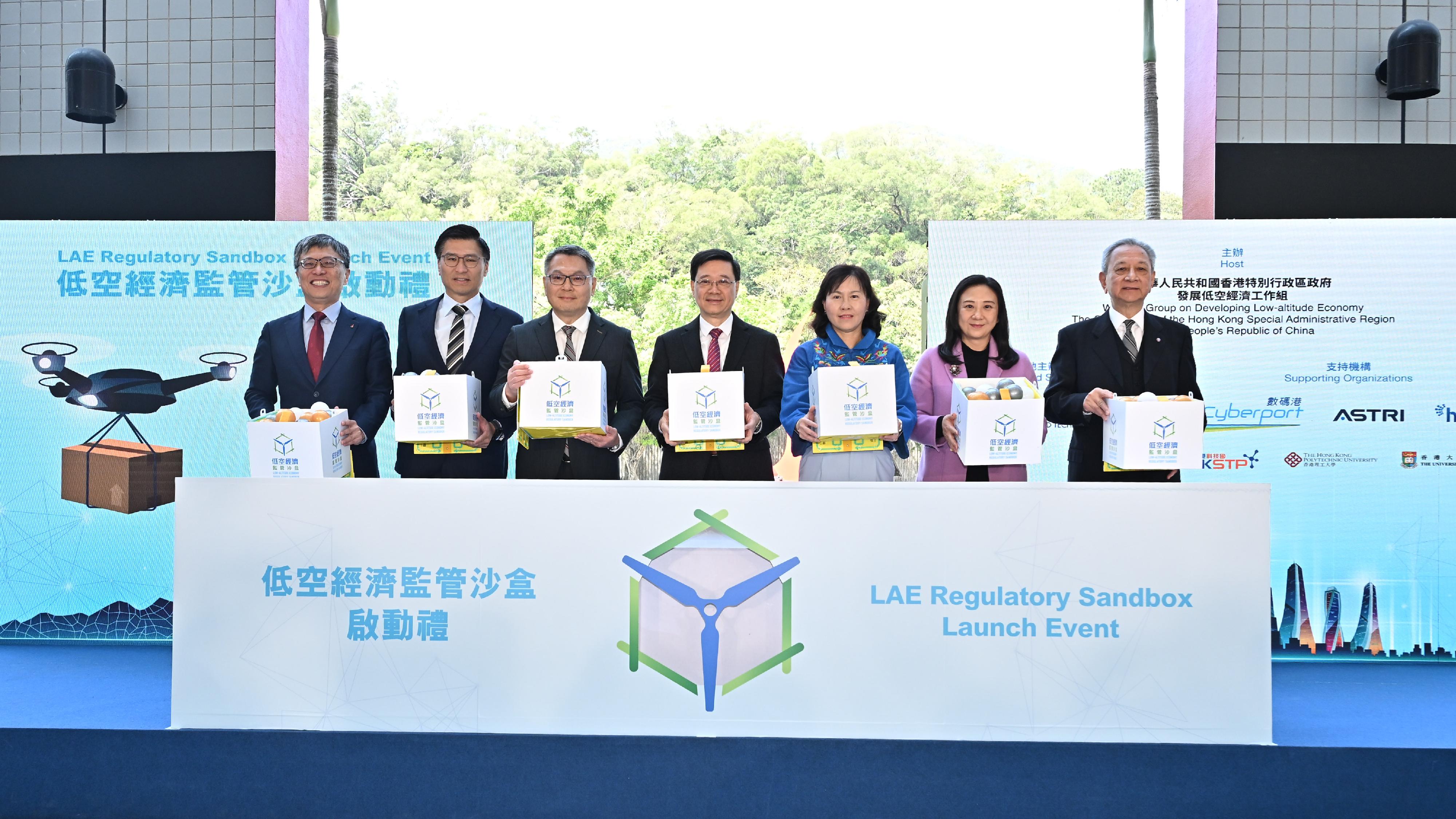 The Chief Executive, Mr John Lee, attended the Low-altitude Economy Regulatory Sandbox - Launch Event today (March 20). Photo shows Mr Lee (centre); the Secretary for Transport and Logistics, Ms Mable Chan (third right); the Director-General of Civil Aviation, Mr Victor Liu (third left); the Council Chairman of the Hong Kong University of Science and Technology, Professor Harry Shum (first left), and other guests officiating at the ceremony.