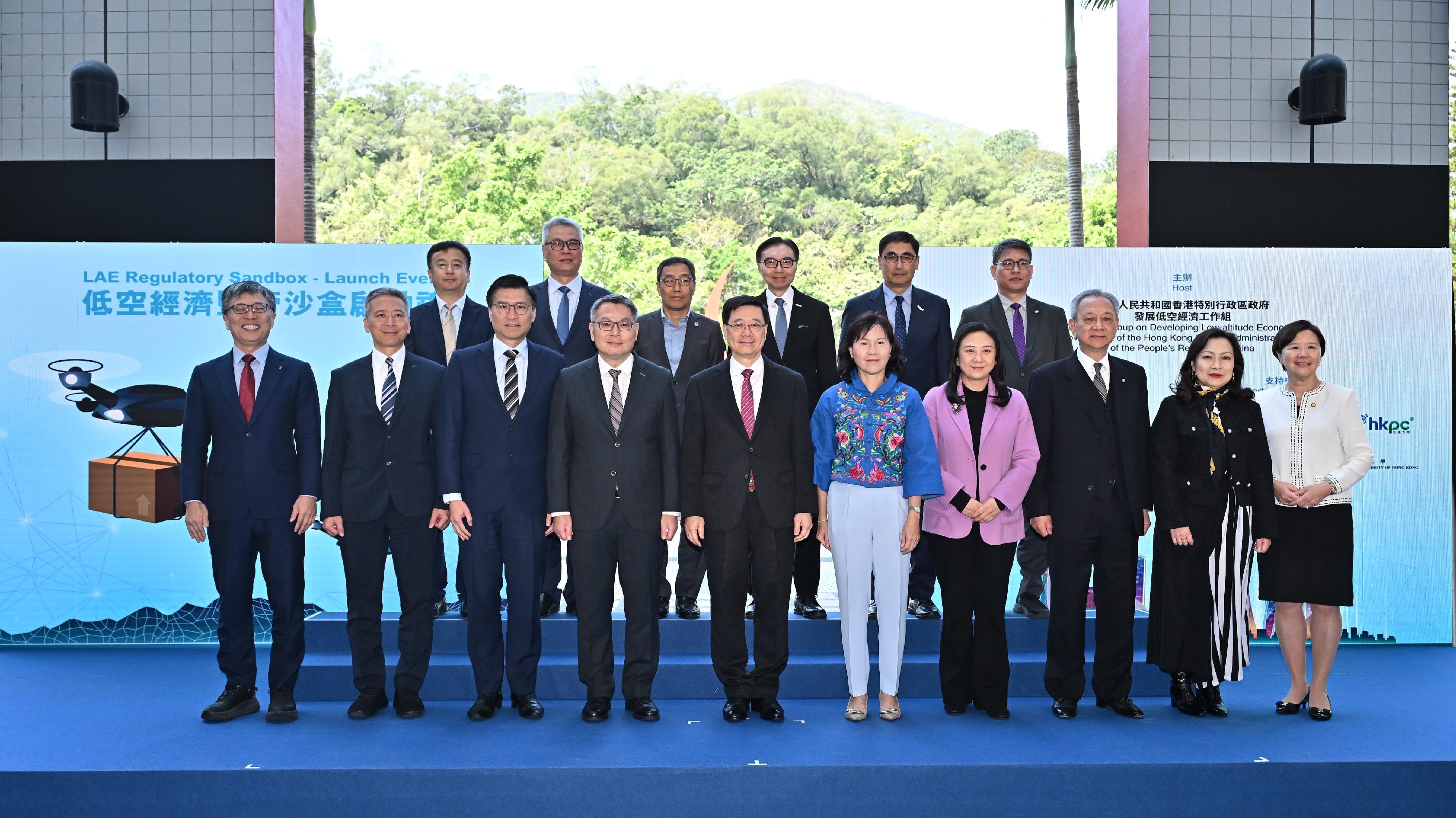 The Chief Executive, Mr John Lee, attended the Low-altitude Economy Regulatory Sandbox - Launch Event today (March 20). Photo shows Mr Lee (front row, fifth left); the Secretary for Transport and Logistics, Ms Mable Chan (front row, fifth right); the Director-General of Civil Aviation, Mr Victor Liu (front row, fourth left); the Council Chairman of the Hong Kong University of Science and Technology, Professor Harry Shum (front row, first left); the President of the Hong Kong University of Science and Technology, Professor Nancy Ip (front row, first right), and other guests at the ceremony.