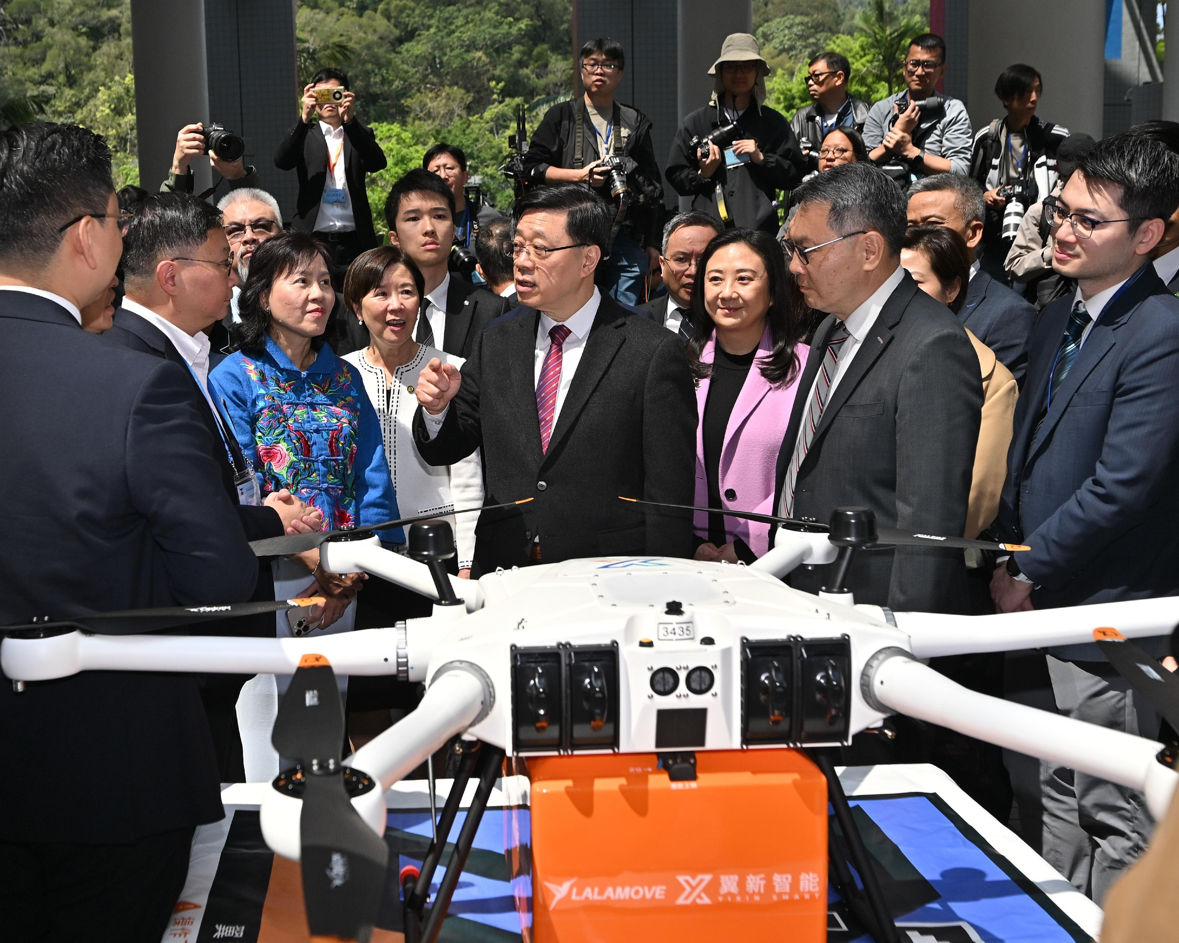 The Chief Executive, Mr John Lee, attended the Low-altitude Economy Regulatory Sandbox - Launch Event today (March 20). Photo shows Mr Lee (second right); the Secretary for Transport and Logistics, Ms Mable Chan (third left); the Director-General of Civil Aviation, Mr Victor Liu (first right), and other guests touring the booths.