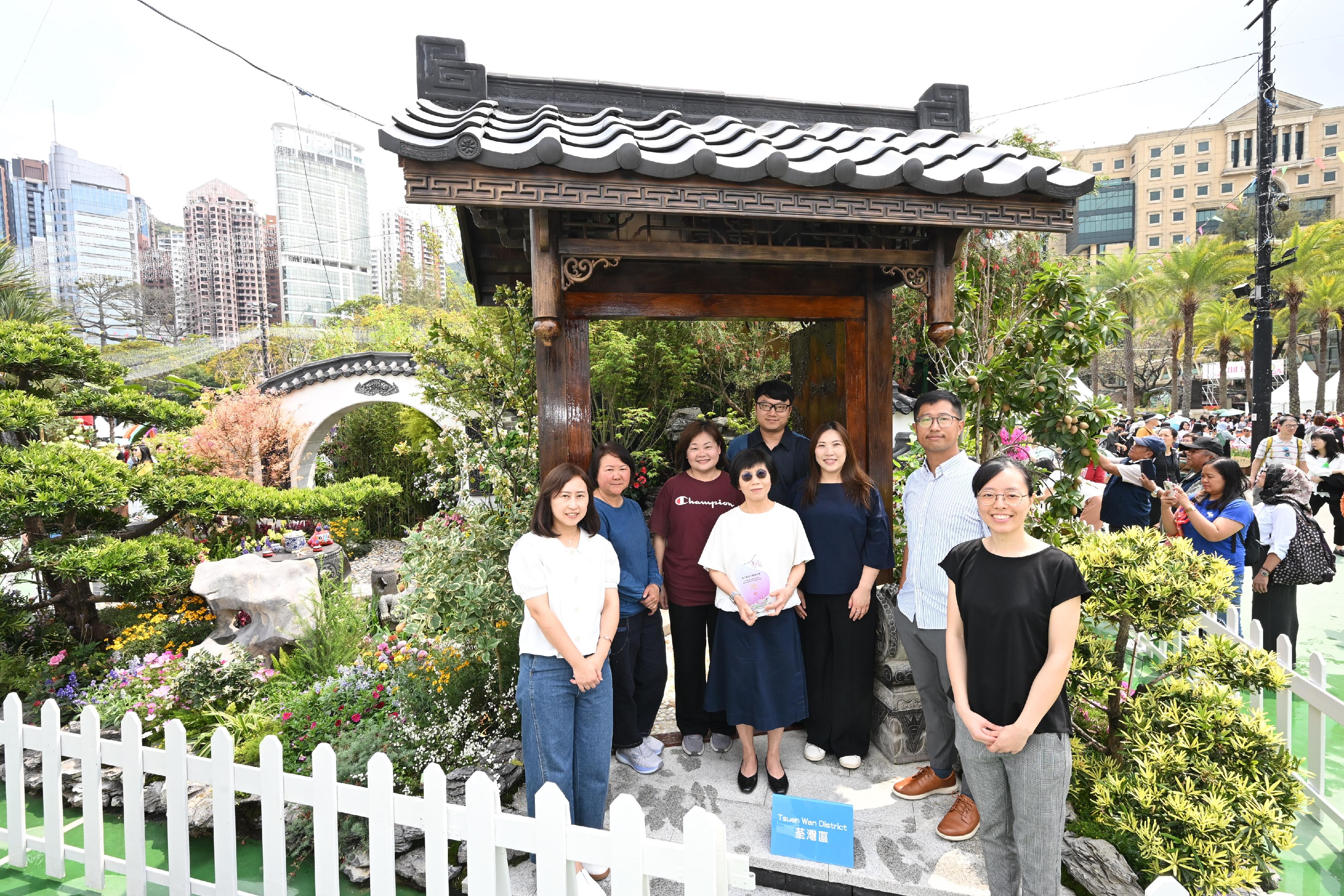 The Hong Kong Flower Show 2025, currently running at Victoria Park, is displaying the winning entries of the Leisure and Cultural Services Department (LCSD)'s Western and Oriental Style Garden Plot Competitions. Photo shows staff of the LCSD's Tsuen Wan District Leisure Services Office in front of their winning Oriental-style garden plot "A Jiangnan Residence".
