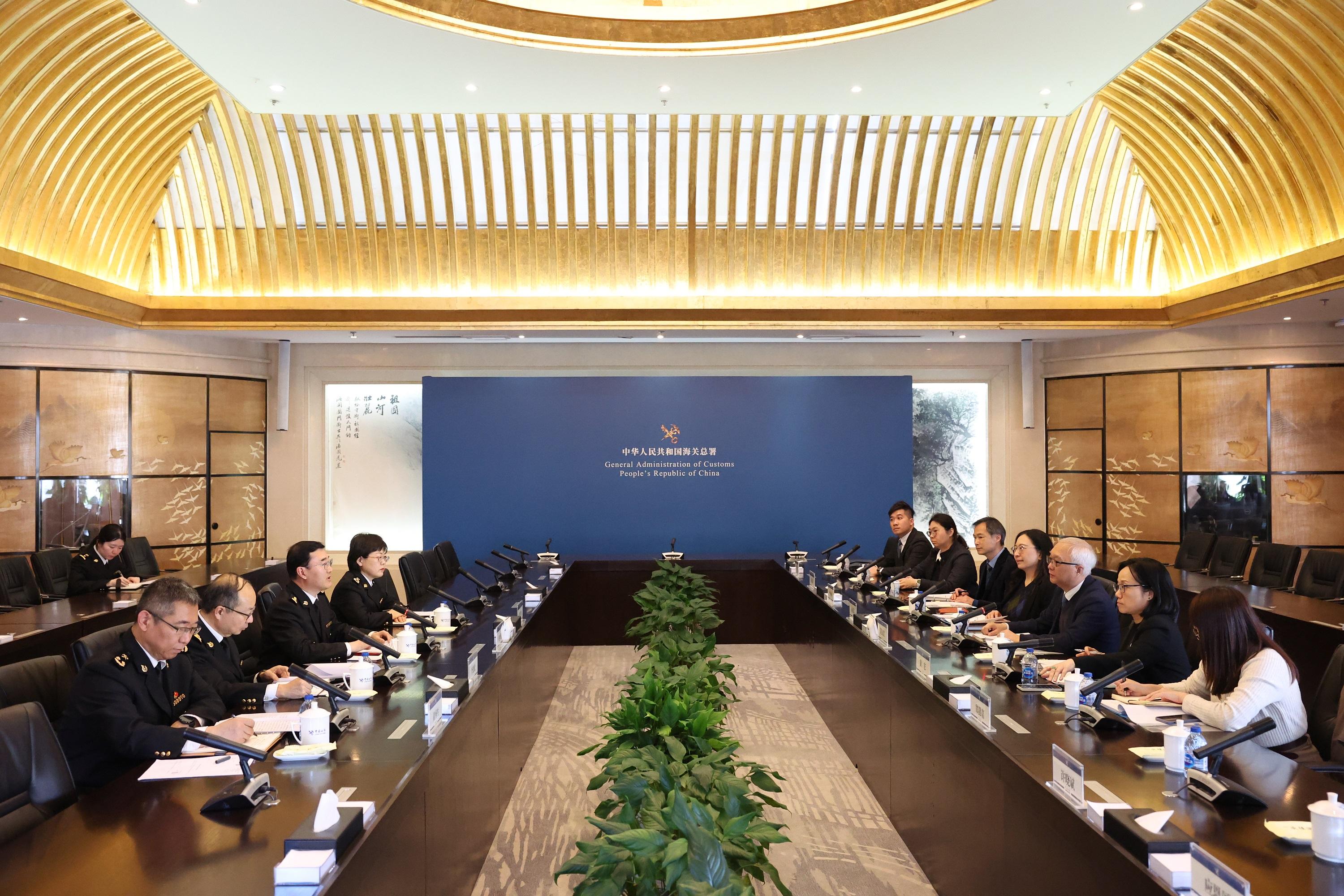 The Secretary for Environment and Ecology, Mr Tse Chin-wan, began his visit in Beijing today (March 20). Photo shows Mr Tse (third right); the Permanent Secretary for Environment and Ecology (Food), Ms Irene Young (fourth right); and the Controller of the Centre for Food Safety, Dr Christine Wong (second right), paying a courtesy call on the General Administration of Customs of the People's Republic of China (GACC) and meeting with the Vice Minister of the GACC, Mr Zhao Zenglian (third left). 