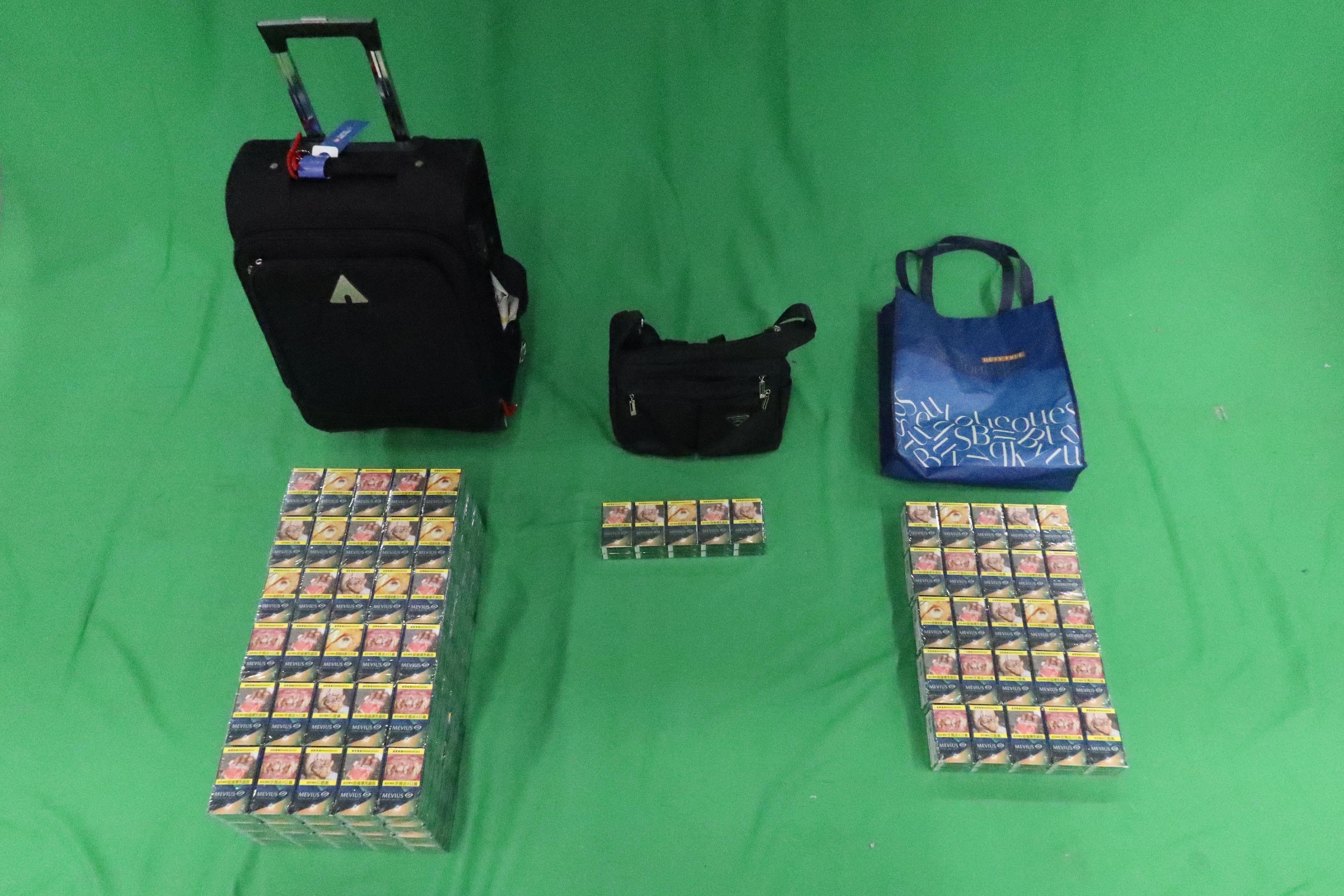 An incoming 74-year-old female passenger was sentenced to 38 days' imprisonment and fined of $1,000 at the Kowloon City Magistrates' Courts today (March 22) for possessing duty-not-paid cigarettes and failing to declare to Customs Officers, in contravention of the Dutiable Commodities Ordinance. Photo shows the duty-not-paid cigarettes seized.