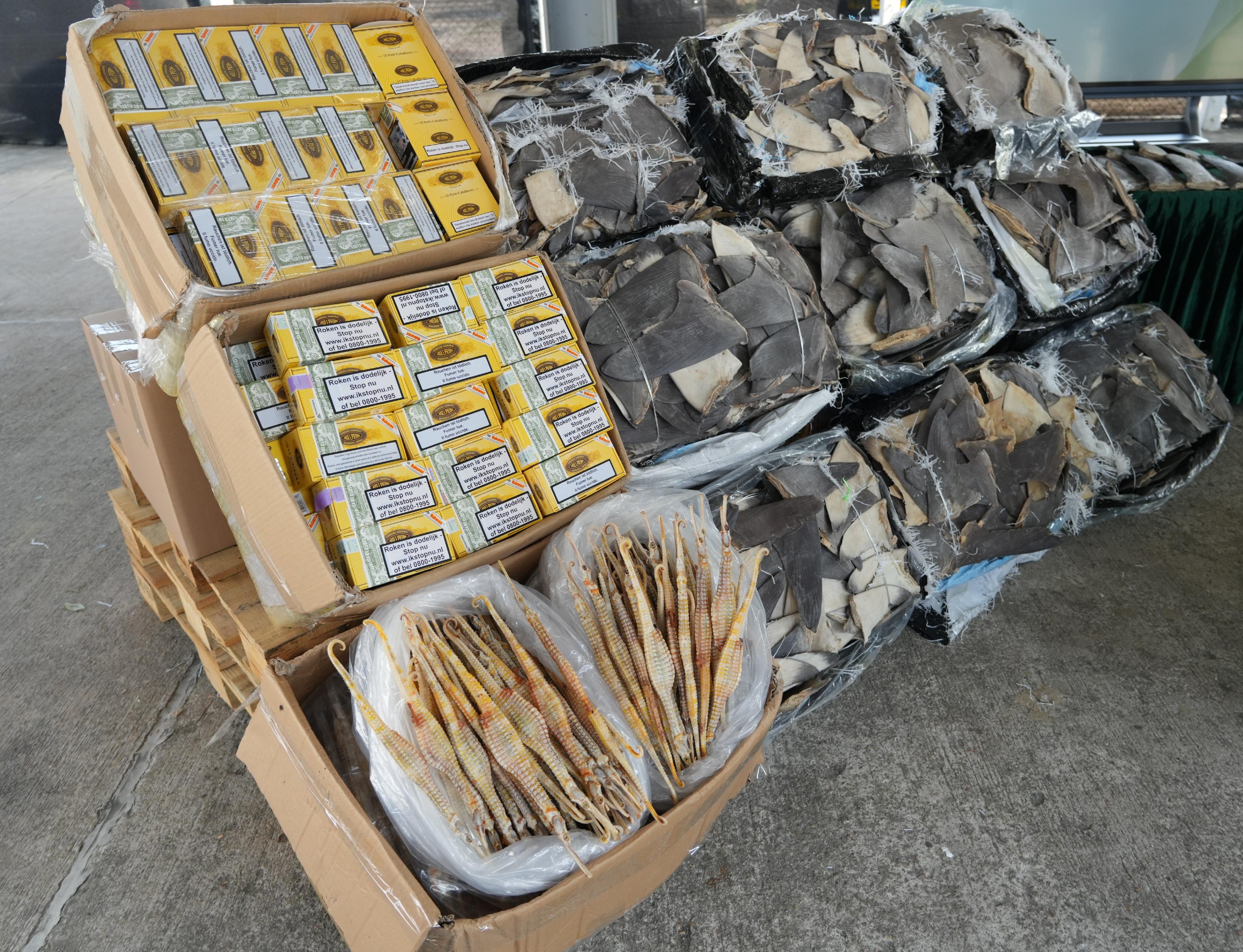 Hong Kong Customs on March 22 detected a suspected smuggling case involving a fishing vessel in the western waters of Hong Kong. A batch of smuggled goods with a total estimated market value of about $25 million was seized. Photo shows some of the suspected smuggled goods seized, including suspected scheduled dried shark fins, cigars and dried syngnathus. 