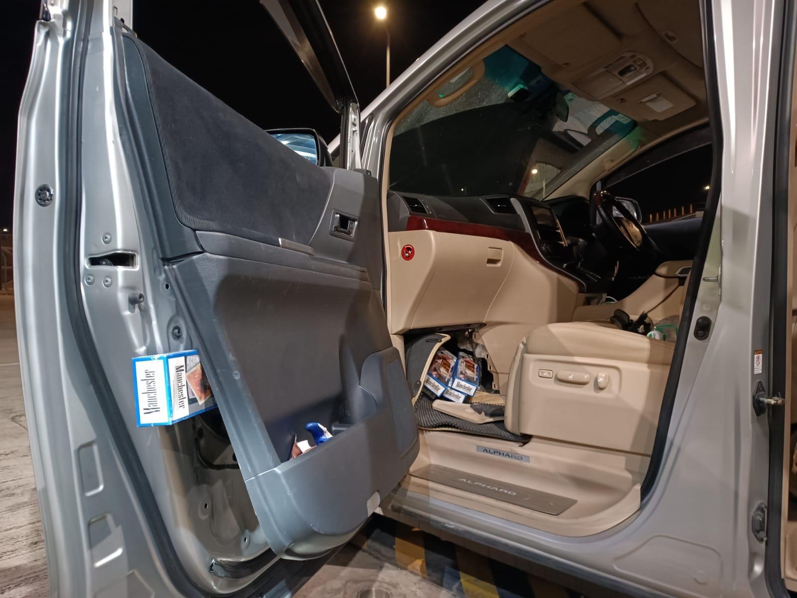 A 38-year-old incoming male driver was sentenced to three months' imprisonment and fined $1,000 at the West Kowloon Magistrates' Courts today (March 25) for importing duty-not-paid cigarettes and failing to declare to Customs Officers, in contravention of the Dutiable Commodities Ordinance. Photo shows some of the duty-not-paid cigarettes concealed inside the hollow space of the front doors of the private car concerned.
