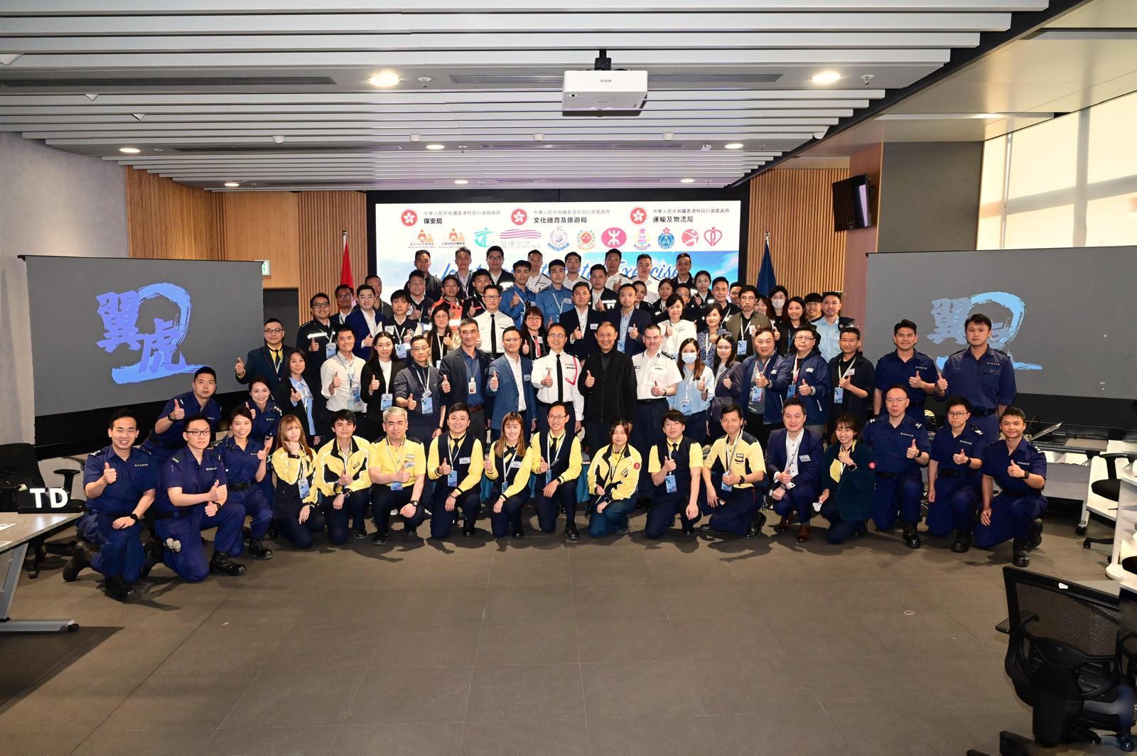The Kowloon East Region of the The Kowloon East Region of the Hong Kong Police Force conducted the second phase inter-departmental tabletop exercise for the Kai Tak Sports Park at the Kowloon East Regional Headquarters today (March 25). Photo shows the Regional Commander of Kowloon East, Dr Law Yuet-wing (second row, tenth right), picturing with representatives from various government departments and related organisations.