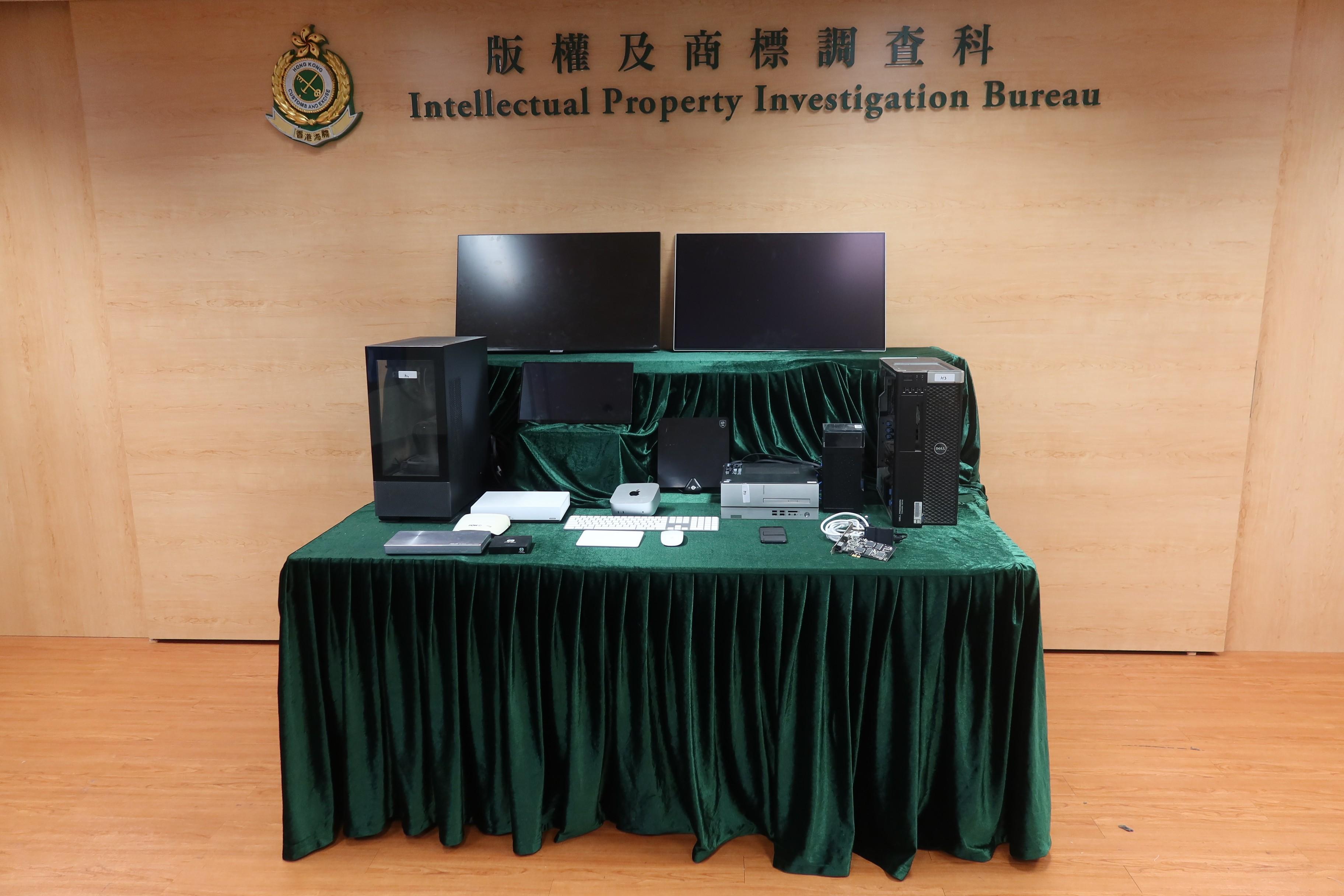 Hong Kong Customs conducted an enforcement operation yesterday (March 25) to combat infringement activities involving illegal communication of TV channels and infringing anime videos to the public by streaming technology. During the operation, Customs seized two TV decoders of pay TV channels, a TV signal receiver set, three sets of computer servers suspected to be used for illegal streaming, a computer used for remote server operation, a mobile phone and an assortment of electronic equipment and audio-visual devices with a total estimated market value of about $40,000. Photo shows some of seized items used for suspected illegal streaming.
