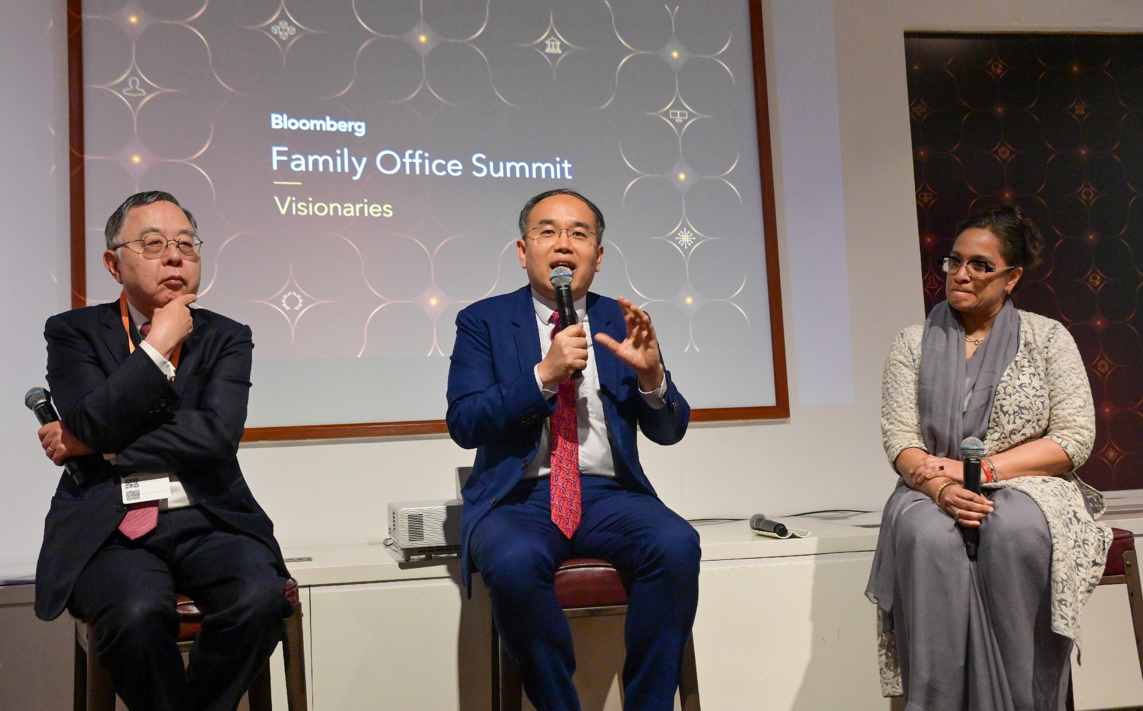 The Secretary for Financial Services and the Treasury, Mr Christopher Hui (centre), joined an exclusive discussion at the inaugural Bloomberg Family Office Summit today (March 27) with the Honorary Chair, Hang Lung Properties Limited, Mr Ronnie Chan (left), for leading family offices to present to them how they can leverage Hong Kong's professional services and philanthropy network to bring social impacts. Looking on is the moderator, Partner and Co-Founder of Dasra, Ms Neera Nundy (right).