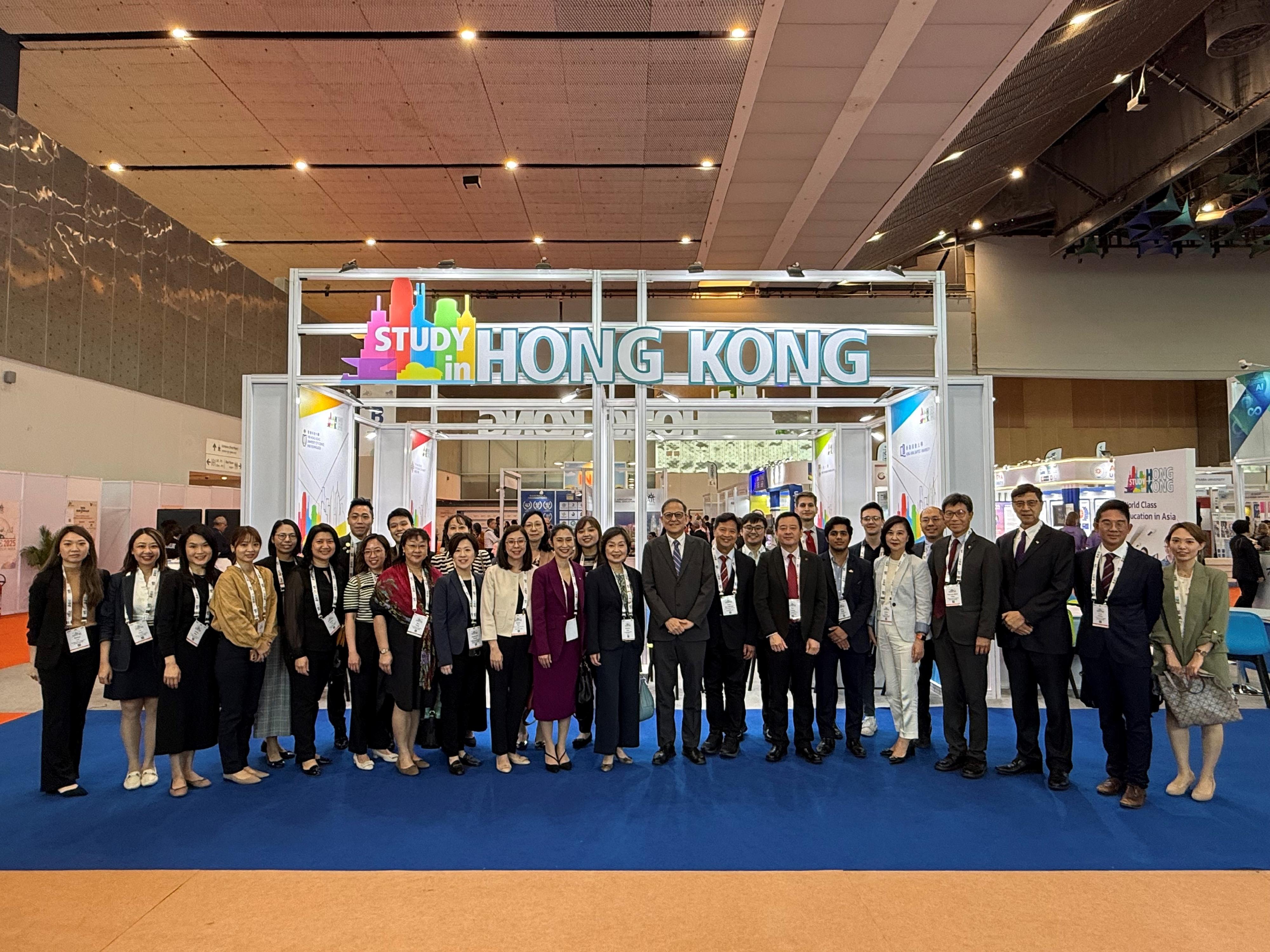 The Secretary for Education, Dr Choi Yuk-lin, visited the Hong Kong Pavilion set up by the Heads of Universities Committee Standing Committee on Internationalisation and funded by the University Grants Committee at the Asia-Pacific Association for International Education (APAIE) 2025 Conference and Exhibition in Delhi, India, on March 27 (Delhi time). Photo shows Dr Choi (front row, 10th right) and the Secretary-General of the University Grants Committee, Professor James Tang (front row, ninth right), with university representatives participating in the Exhibition. 