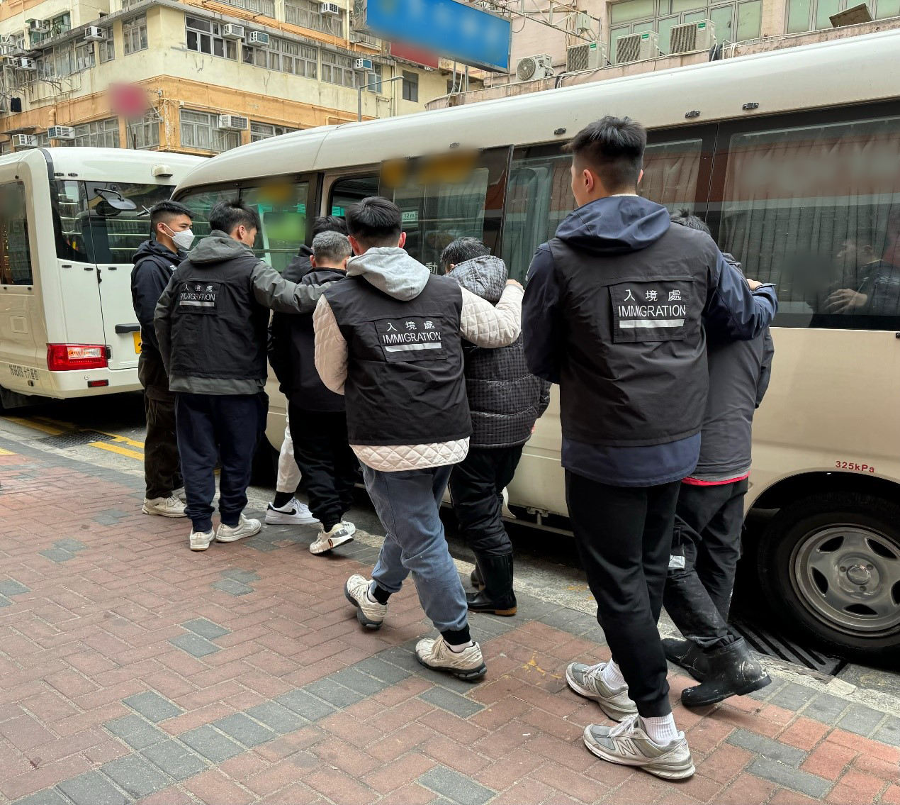 The Immigration Department mounted a series of territory-wide anti-illegal worker operations codenamed "Twilight", and a joint operation with the Hong Kong Police Force codenamed " Champion", for four consecutive days from March 24 to yesterday (March 27). Photo shows suspected illegal workers arrested during an operation.
