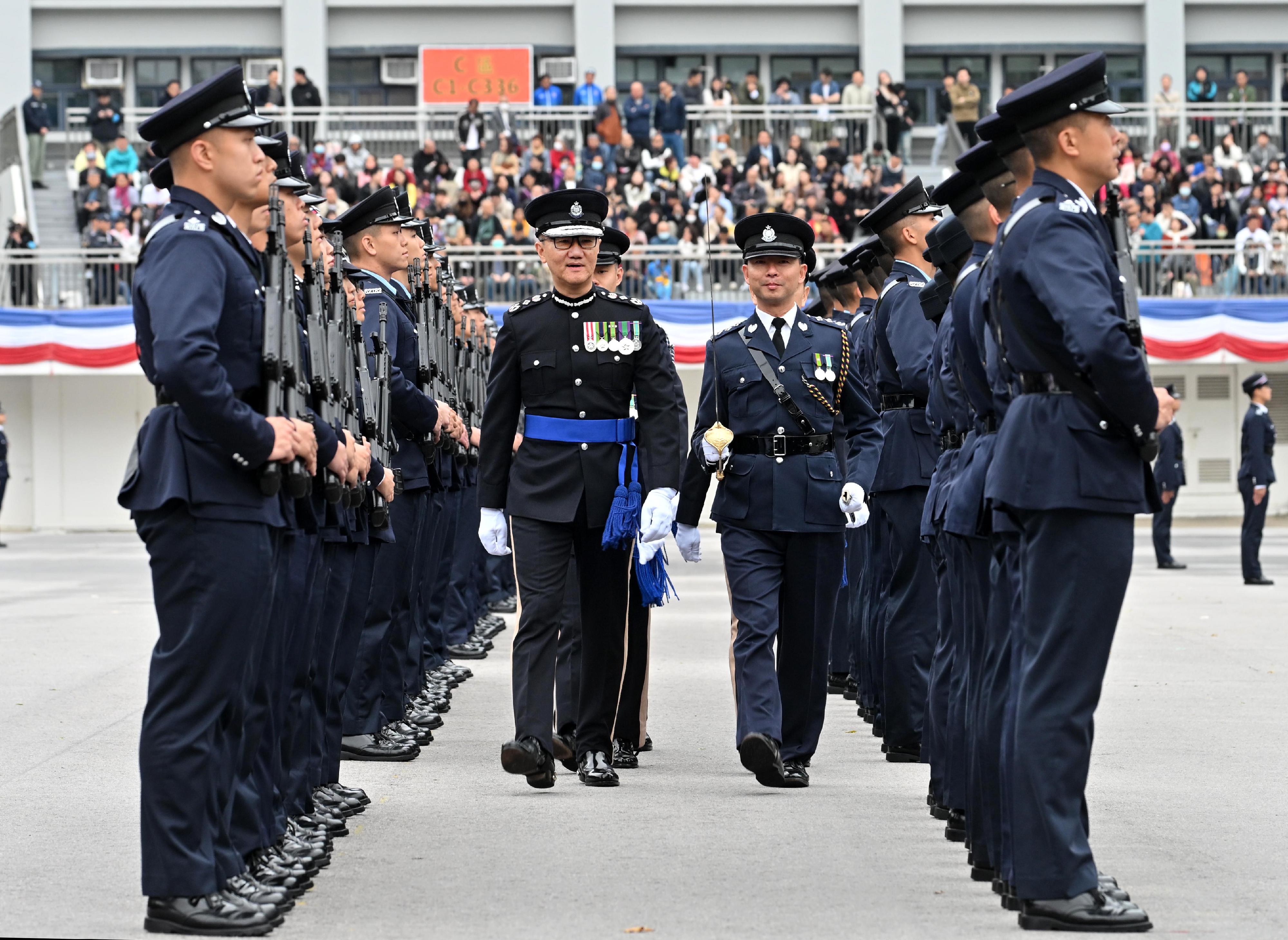 The Commissioner of Police, Mr Siu Chak-yee, inspects a passing-out parade as reviewing officer at the Hong Kong Police College today (March 29).