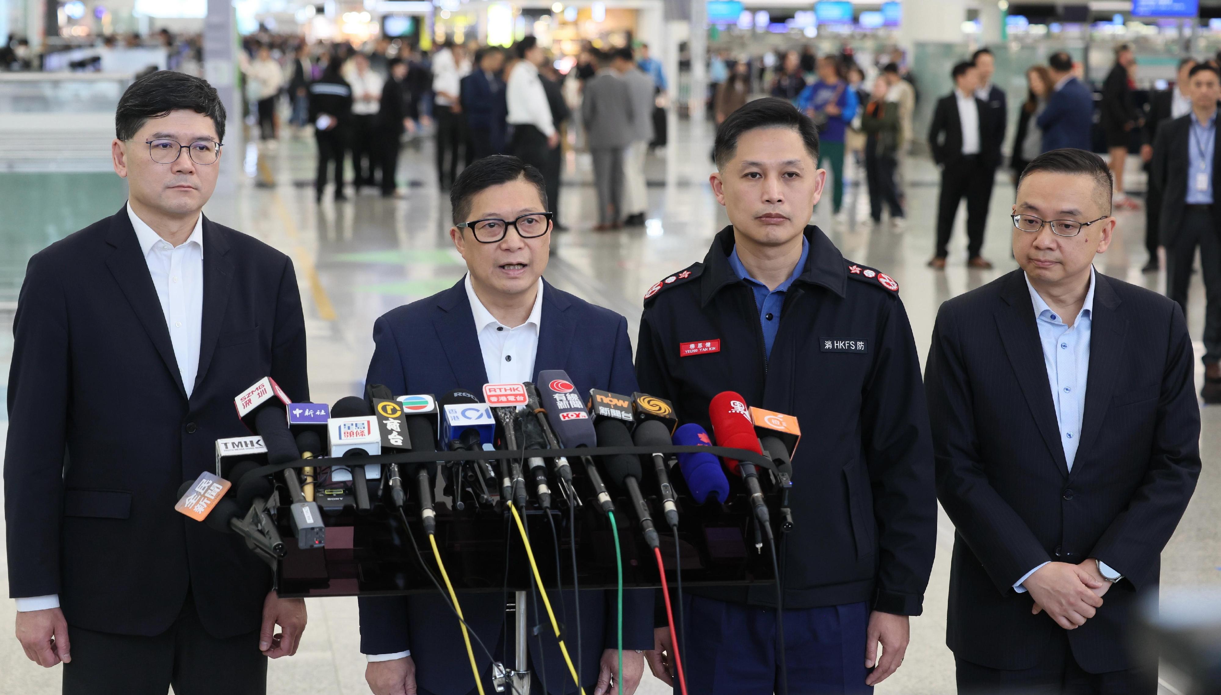 The Hong Kong Special Administrative Region Government sent a 51-strong search and rescue team to the quake-stricken areas in Myanmar this afternoon (March 29) to assist in the search and rescue work. Photo shows the Secretary for Security, Mr Tang Ping-keung (second left); the Director of Immigration, Mr Benson Kwok (first right); the Director of Fire Services, Mr Andy Yeung (second right); and the Chief Executive of the Hospital Authority, Dr Tony Ko (first left), meeting the media.