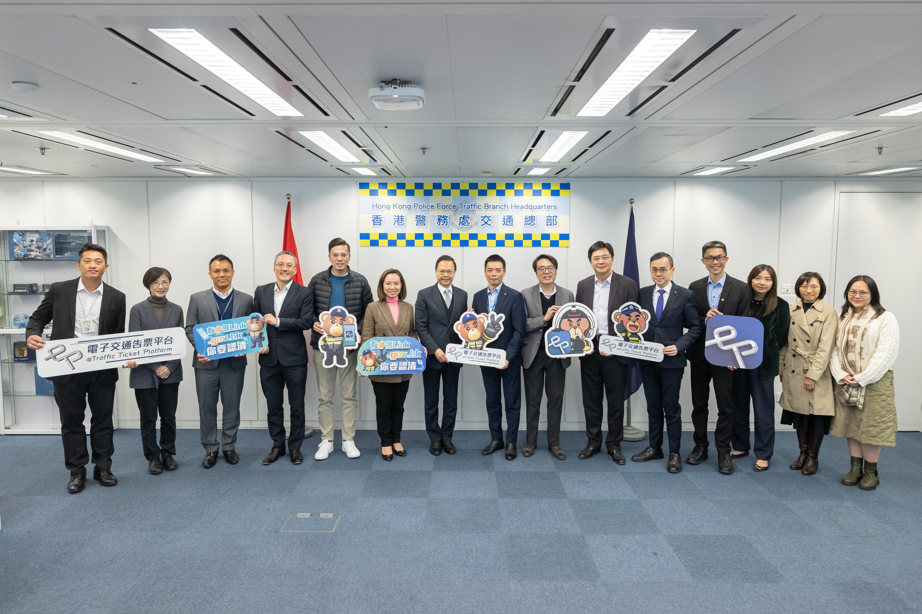 The Legislative Council (LegCo) Panel on Transport visited the Police Headquarters today (April 1) to observe a demonstration of the eTraffic Penalty Ticket platform functions to learn about the latest measures of the Hong Kong Police Force (the Police) issuing electronic penalty tickets (ePTs) starting from June 15. Photo shows the Chairman of the Panel on Transport, Mr Chan Siu-hung (seventh left), and other Members  with representatives of the Transport and Logistics Bureau and the Police at the Police Headquarters.