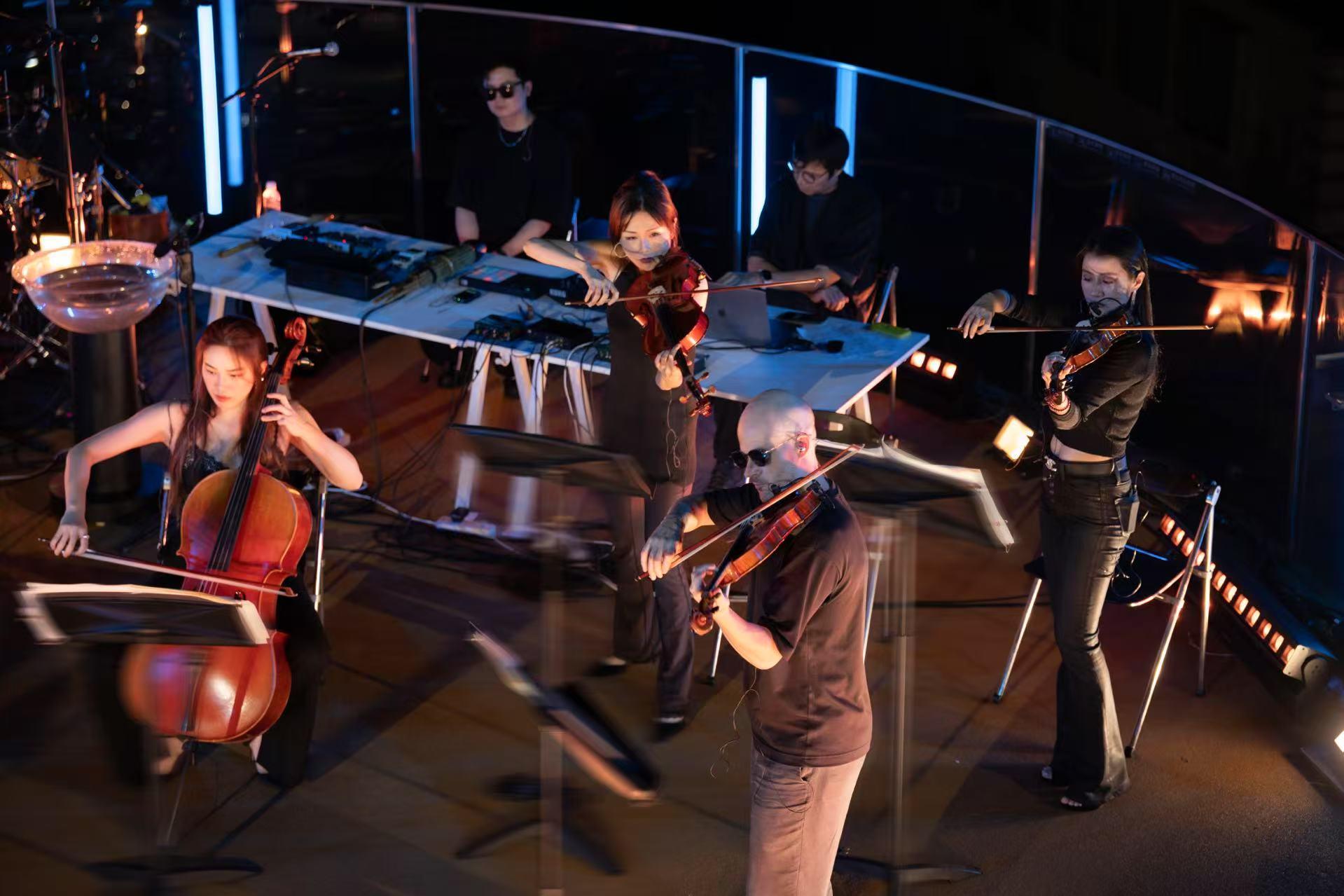 Ambassador for Cultural Promotion Tan Dun has lined up local young talents to perform at international performances. Photo shows violinist Liu Fangxi (first right) performing in a string quartet in the 2024 Tan Dun Summer Music Festival in Qingdao on July 23, 2024. 