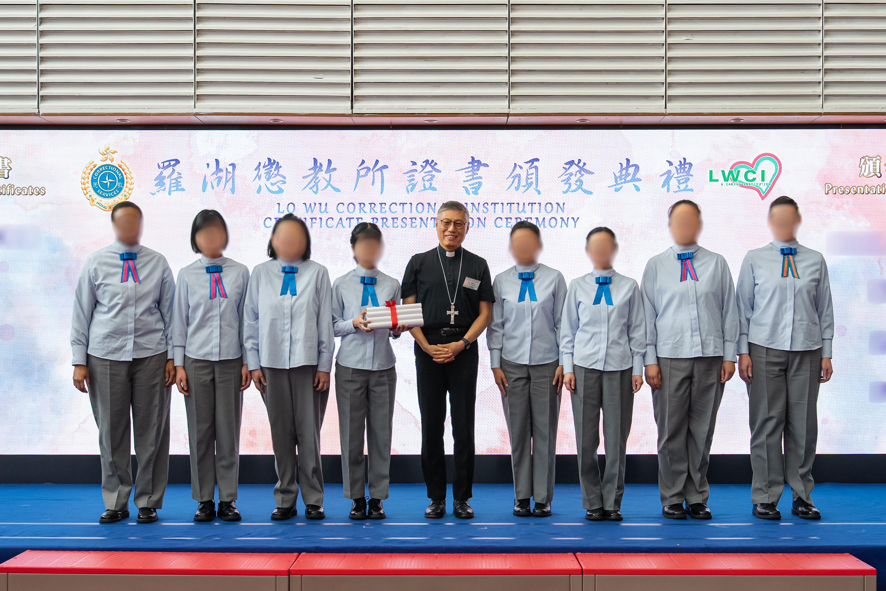 Persons in custody at Lo Wu Correctional Institution of the Correctional Services Department were presented with certificates at a ceremony today (April 2) in recognition of their continuous efforts in pursuing further studies. Photo shows the Bishop of the Catholic Diocese of Hong Kong, Cardinal Stephen Chow (centre), presenting certificates to persons in custody.