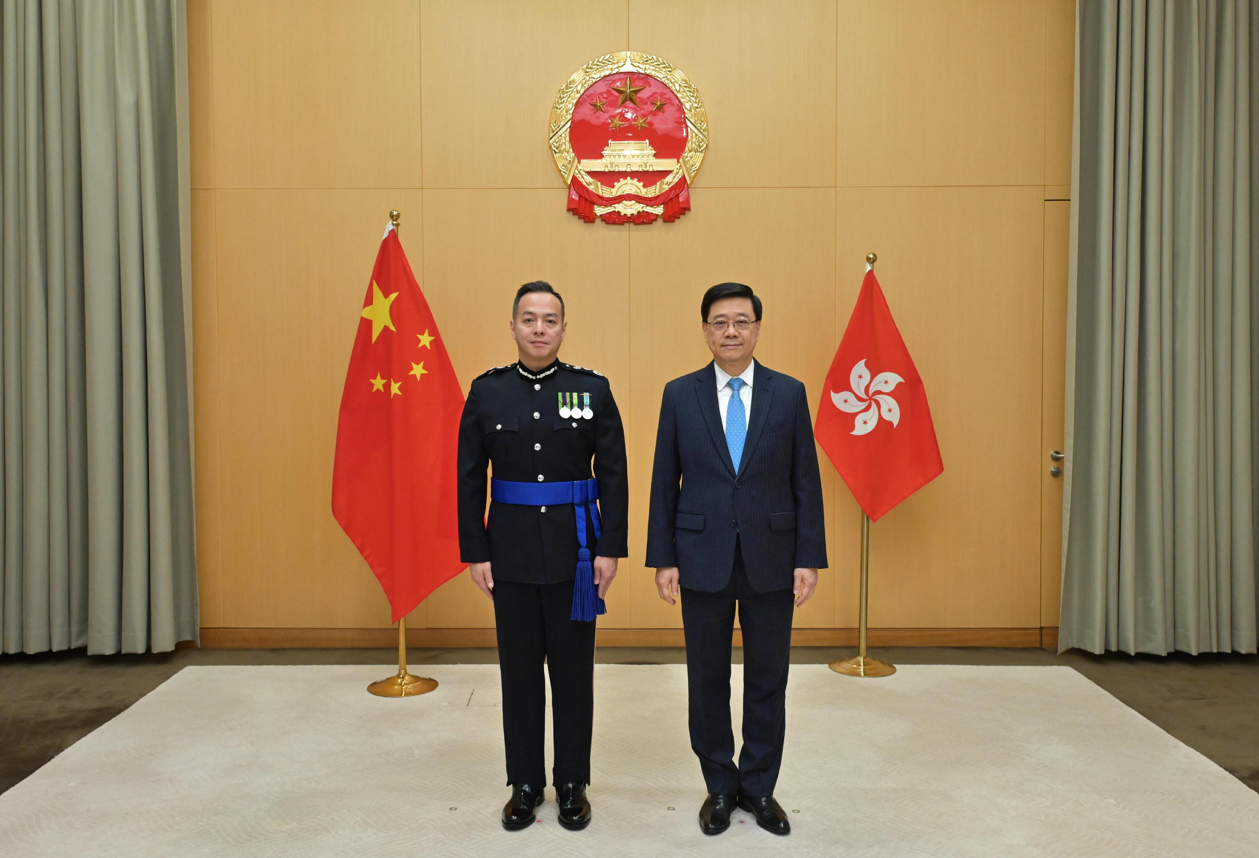 The Chief Executive, Mr John Lee (right), is pictured with the new Commissioner of Police, Mr Chow Yat-ming, Joe (left), today (April 2).