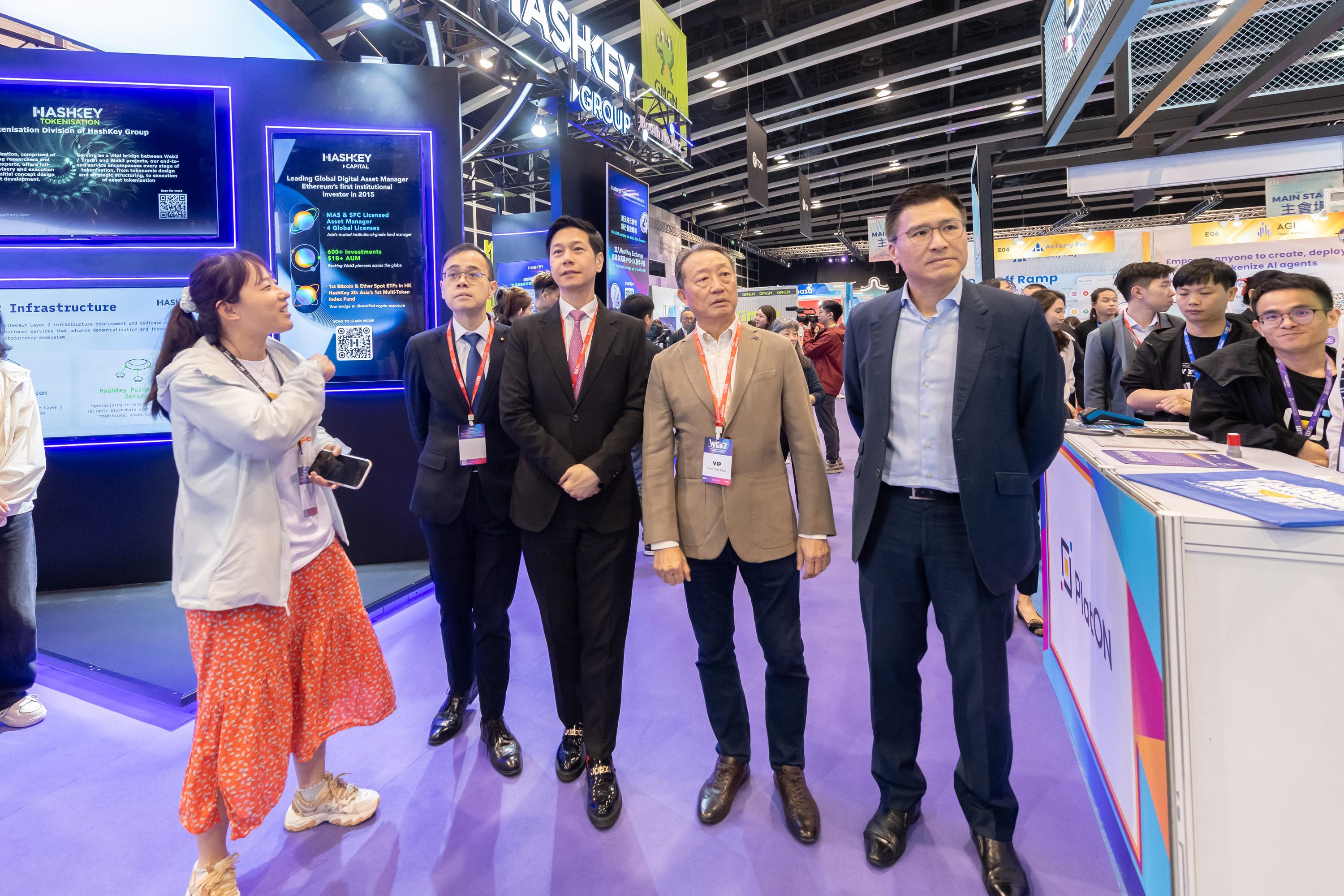 The Legislative Council Subcommittee on Issues Relating to the Development of Web3 and Virtual Assets visited the Hong Kong Web3 Festival being held at Hong Kong Convention and Exhibition Centre today (April 7). Photo shows Members receiving a briefing from representatives of Hong Kong Web3 Festival on the key features of various stages.

