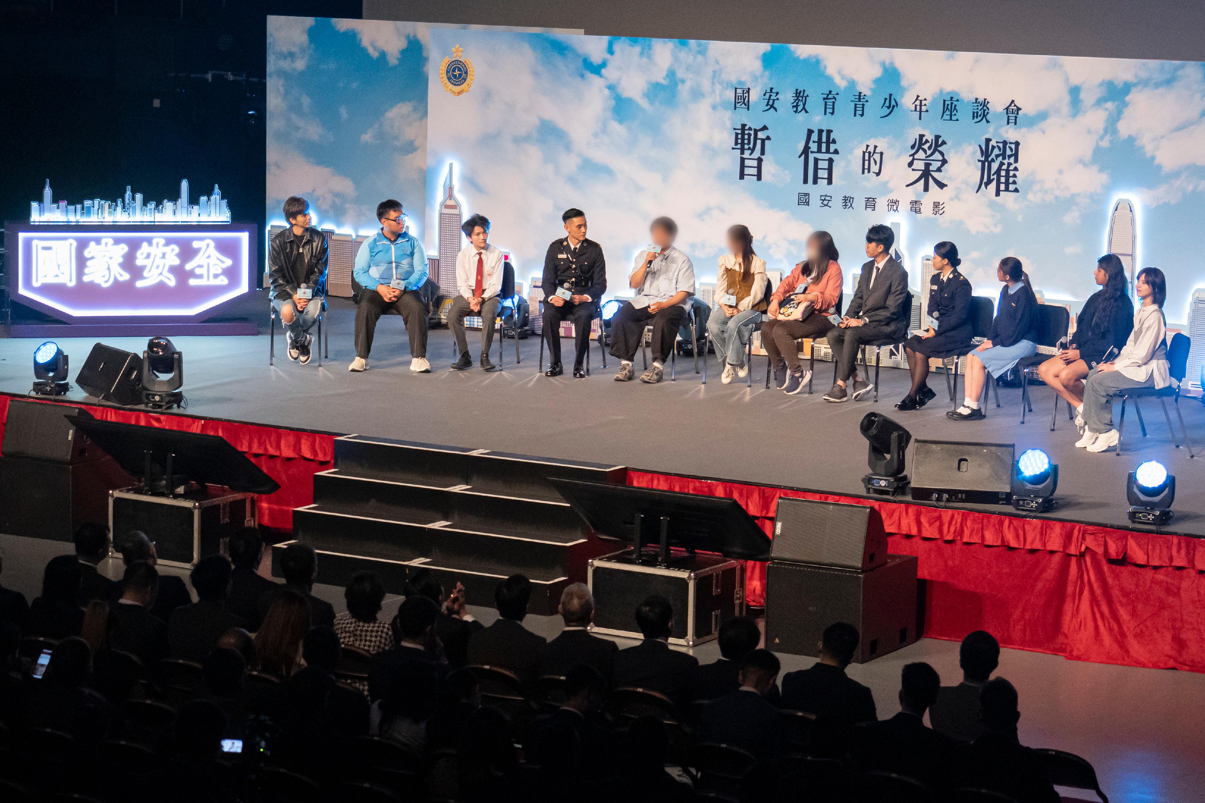 The Correctional Services Department (CSD) today (April 9) held a national security education student forum at Queen Elizabeth Stadium and premiered a national security education microfilm produced by the CSD. Photo shows a rehabilitated person (fifth left) in a sharing session talking about the heavy price he had to pay for committing crimes and advising students to be law-abiding citizens.