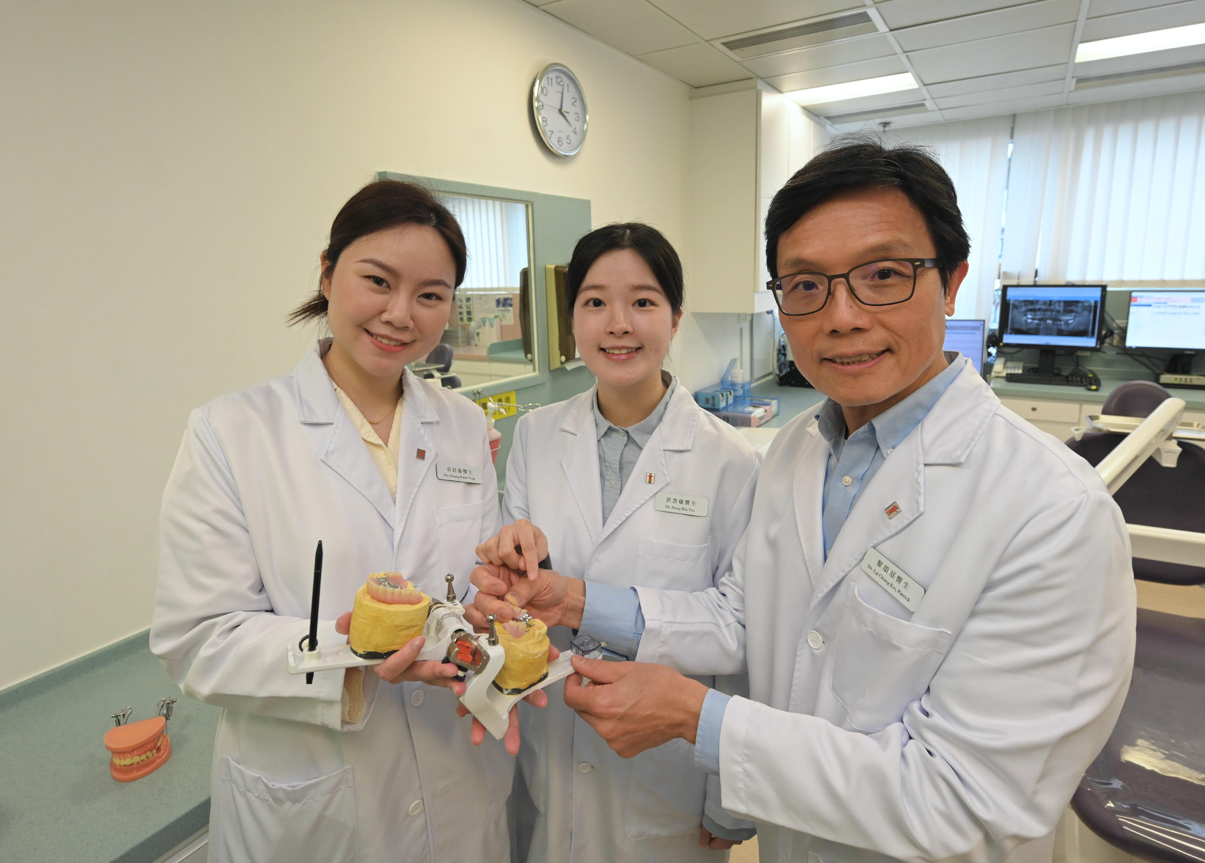 The Department of Health (DH) announced today (April 9) that the first batch of non-locally trained dentists have officially joined the DH in the first quarter of this year to provide dental services to the public. Photo shows three non-locally trained dentists examining a denture.