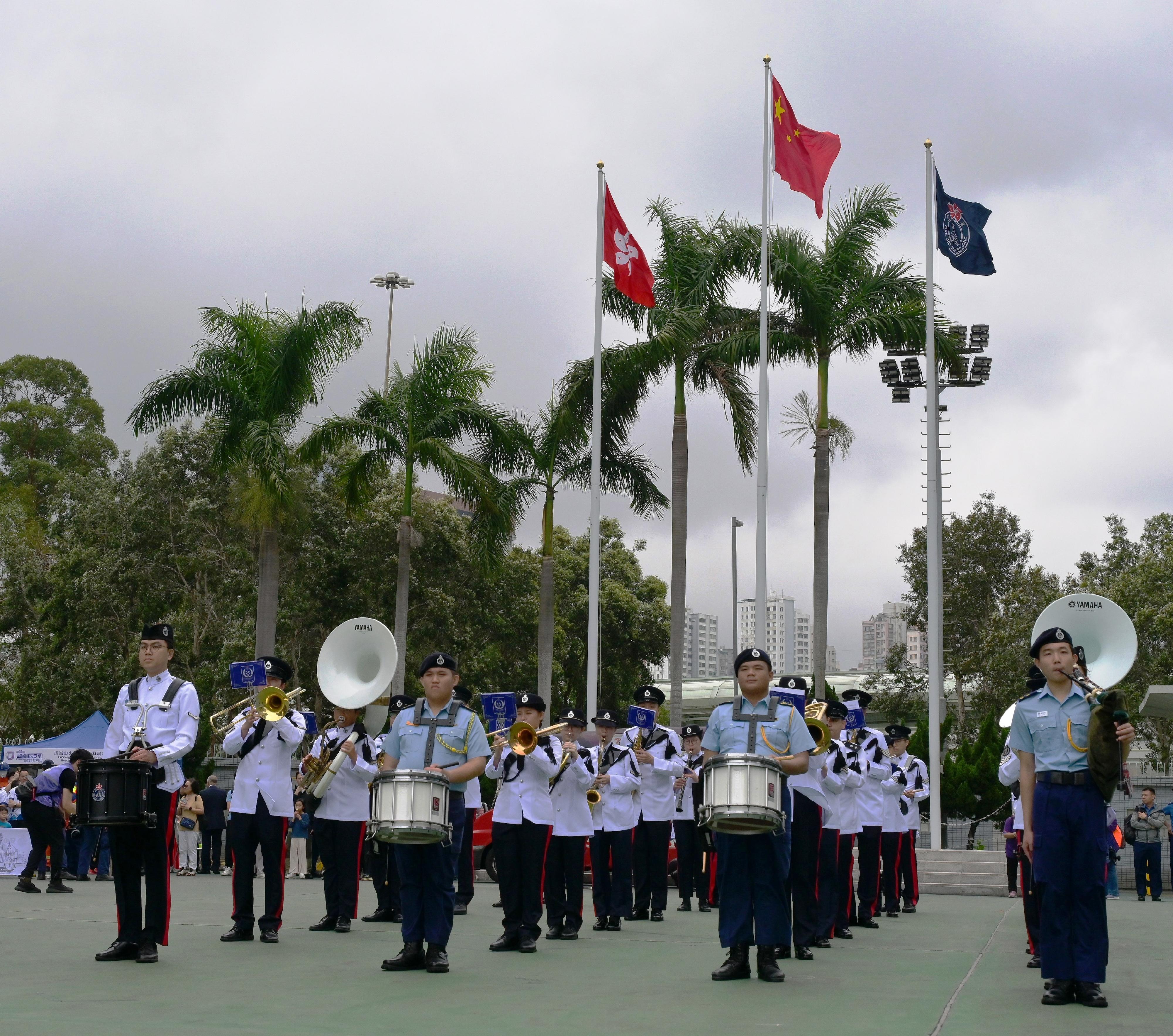 The Civil Aid Service (CAS) held an open day at its headquarters today (April 12) to promote National Security Education Day. Photo shows the CAS Band demonstrating distinctive Chinese military band music.