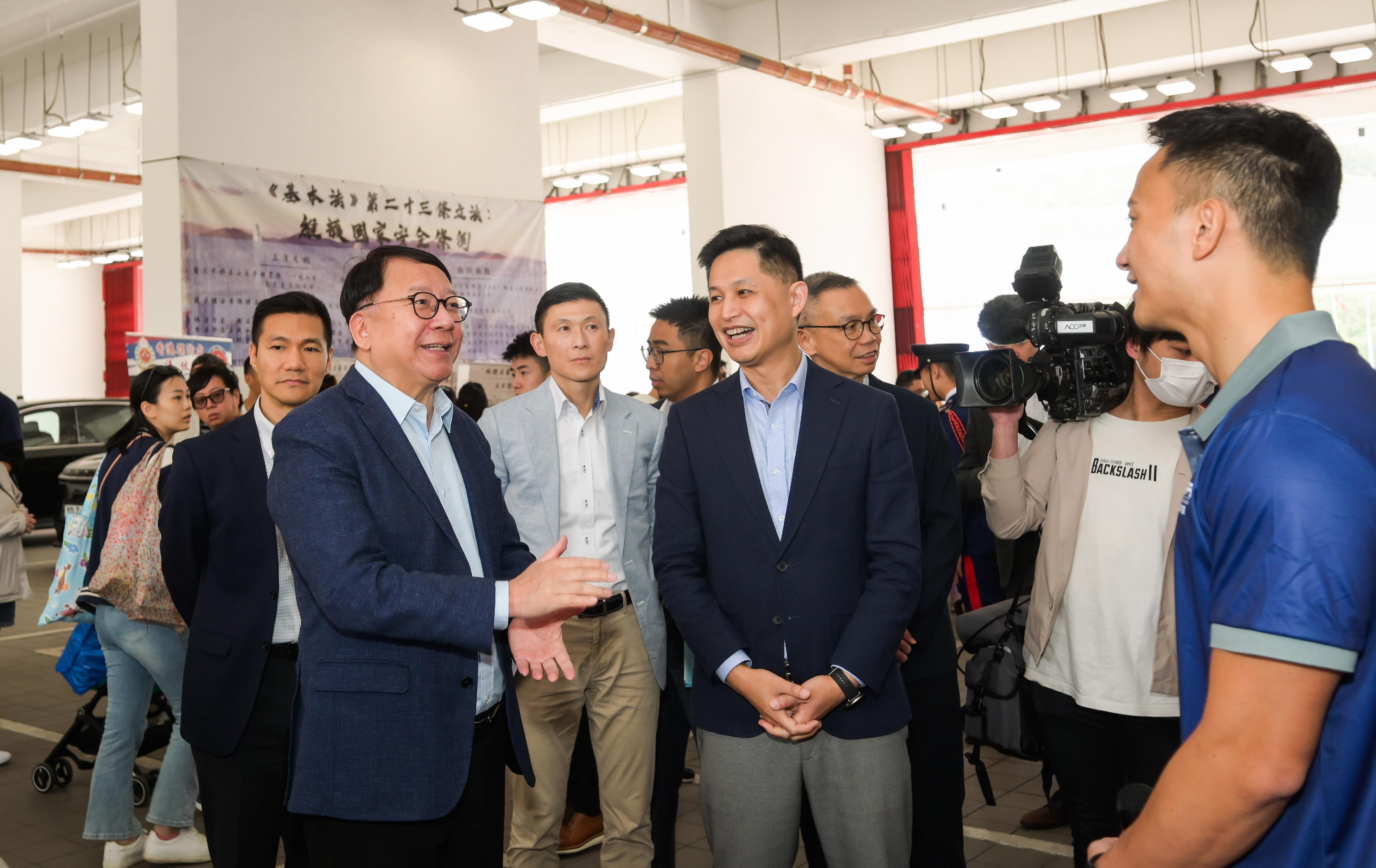 In response to and in support of the 10th National Security Education Day, the Fire Services Department held an open day today (April 13) at the Fire and Ambulance Services Academy in Tseung Kwan O. Photo shows the Chief Secretary for Administration, Mr Chan Kwok-ki (front row, first left), accompanied by the Director of Fire Services, Mr Andy Yeung (front row, second left), visiting the exhibition on national security.
