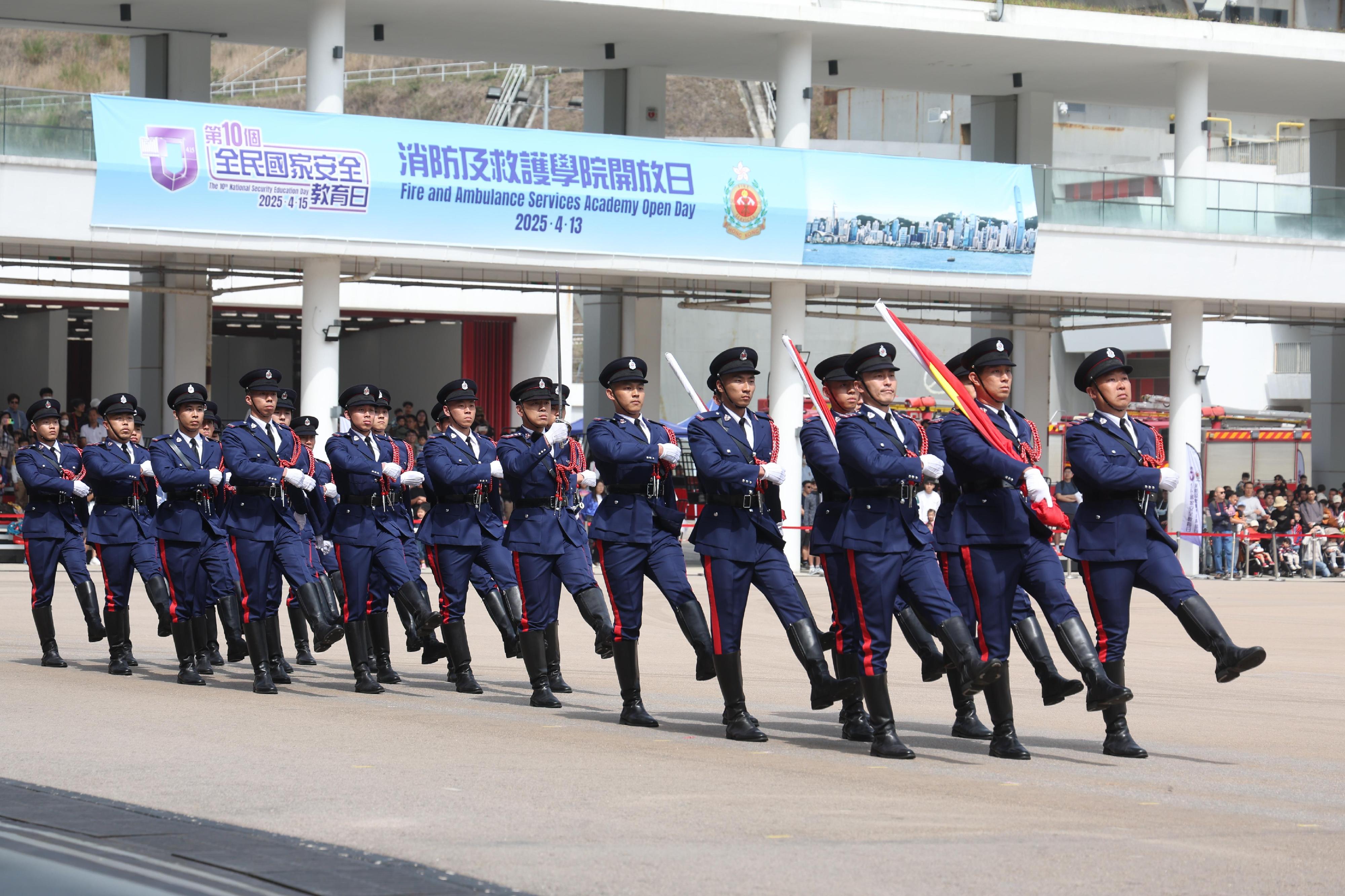 In response to and in support of the 10th National Security Education Day, the Fire Services Department (FSD) held an open day today (April 13) at the Fire and Ambulance Services Academy in Tseung Kwan O. Photo shows the FSD's Guard of Honour marching into the venue with Chinese-style foot drill and conducting the flag-raising ceremony.