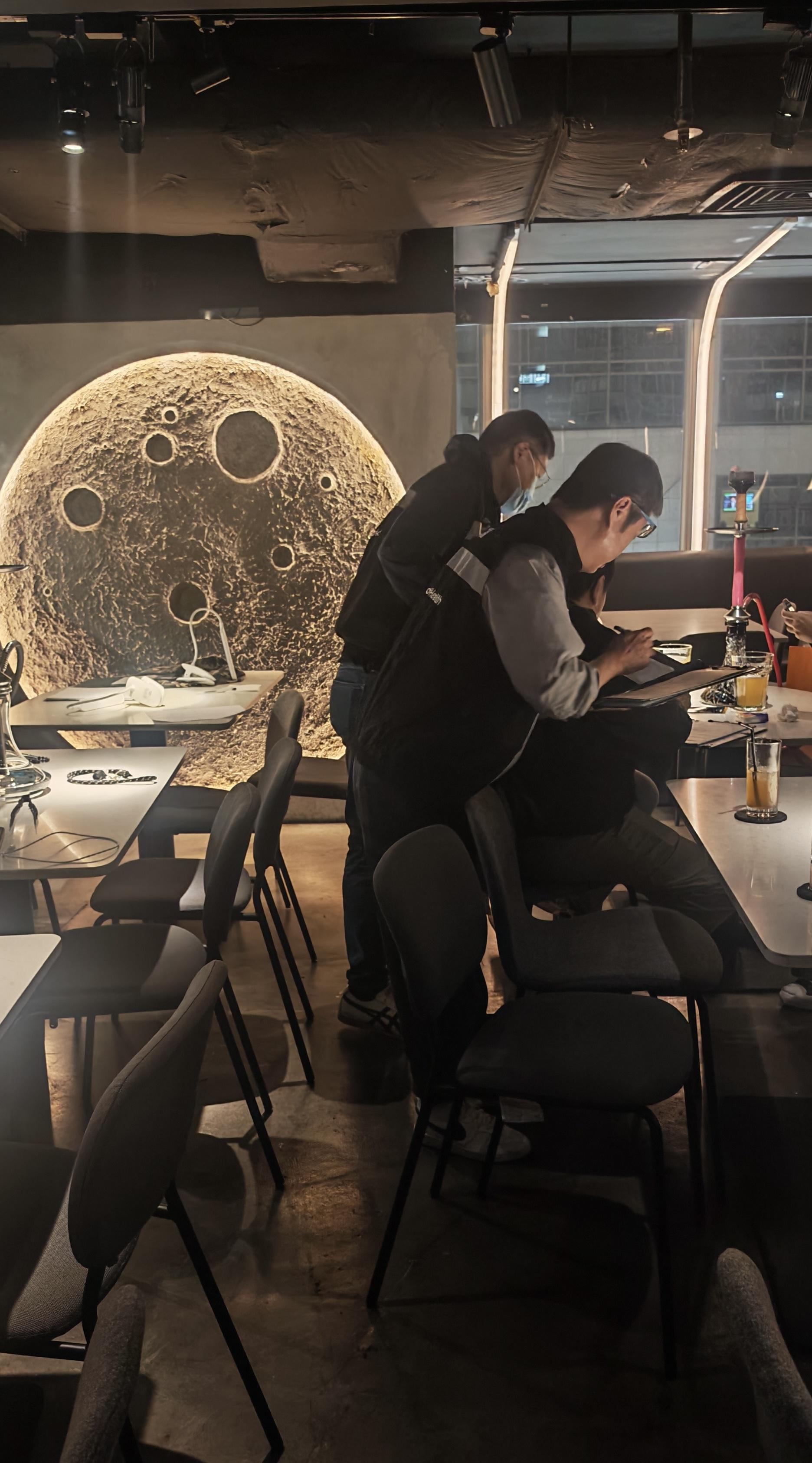 The Tobacco and Alcohol Control Office (TACO) of the Department of Health continued to clamp down on illegal waterpipe smoking in no smoking areas by conducting another enforcement operation, codenamed "Pipepurge", in Mong Kok last night (April 12) and issued a total of four fixed penalty notices. Photo shows TACO officers taking enforcement action inside a bar.  