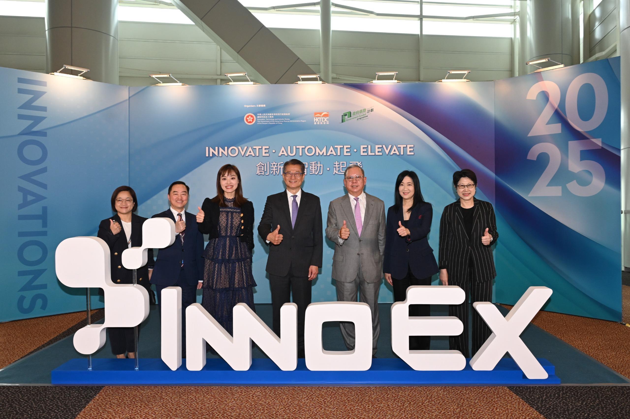 The Financial Secretary, Mr Paul Chan, visited the InnoEX today (April 13). Mr Chan (centre) is pictured with the Under Secretary for Innovation, Technology and Industry, Ms Lillian Cheong (third left); the Commissioner for Digital Policy, Mr Tony Wong (second left); the Chairman of the Hong Kong Trade Development Council, Dr Peter Lam (third right), and other guests. 

