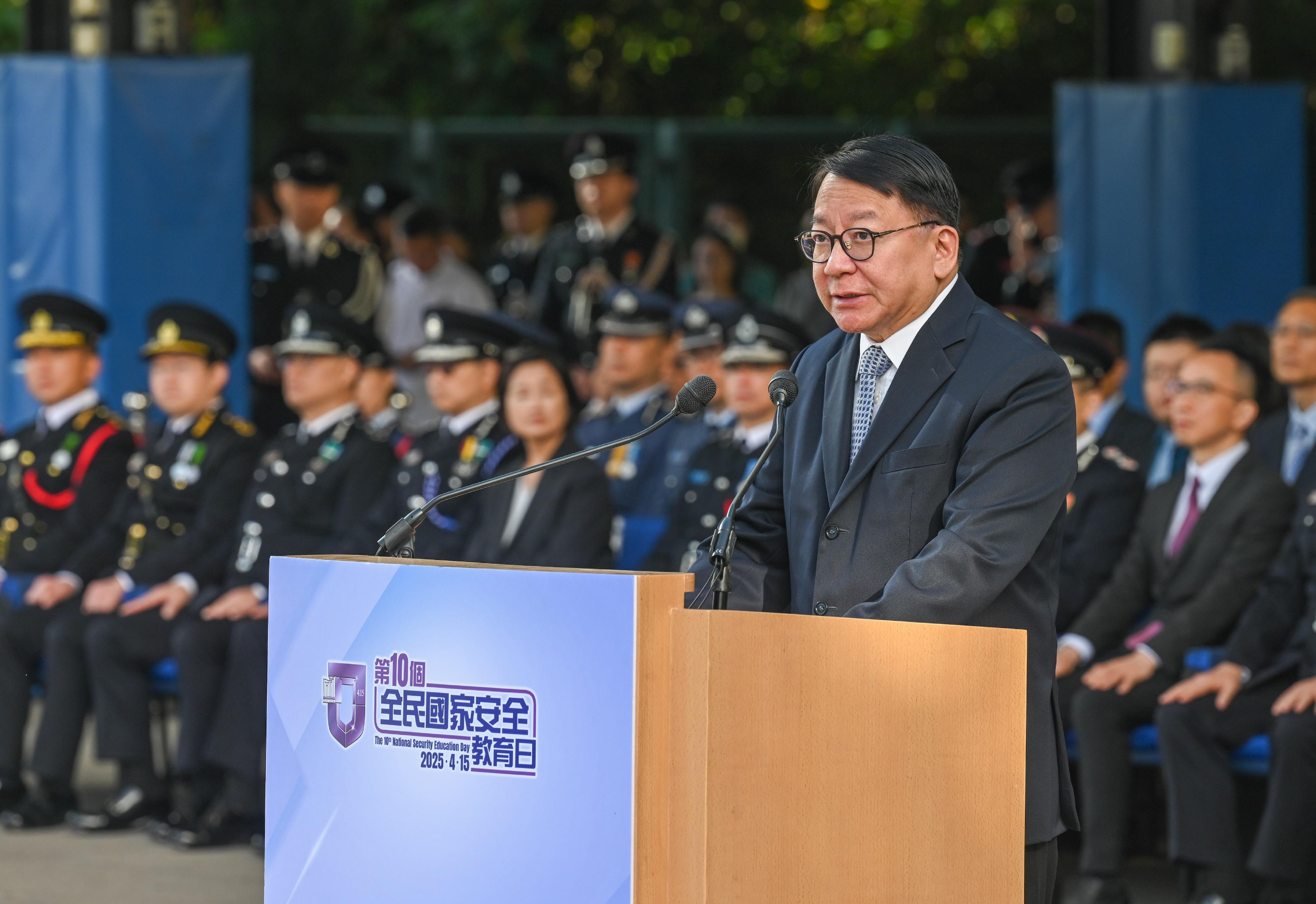 The Chief Secretary for Administration, Mr Chan Kwok-ki, speaks at the National Security Education Day flag raising ceremony today (April 15).