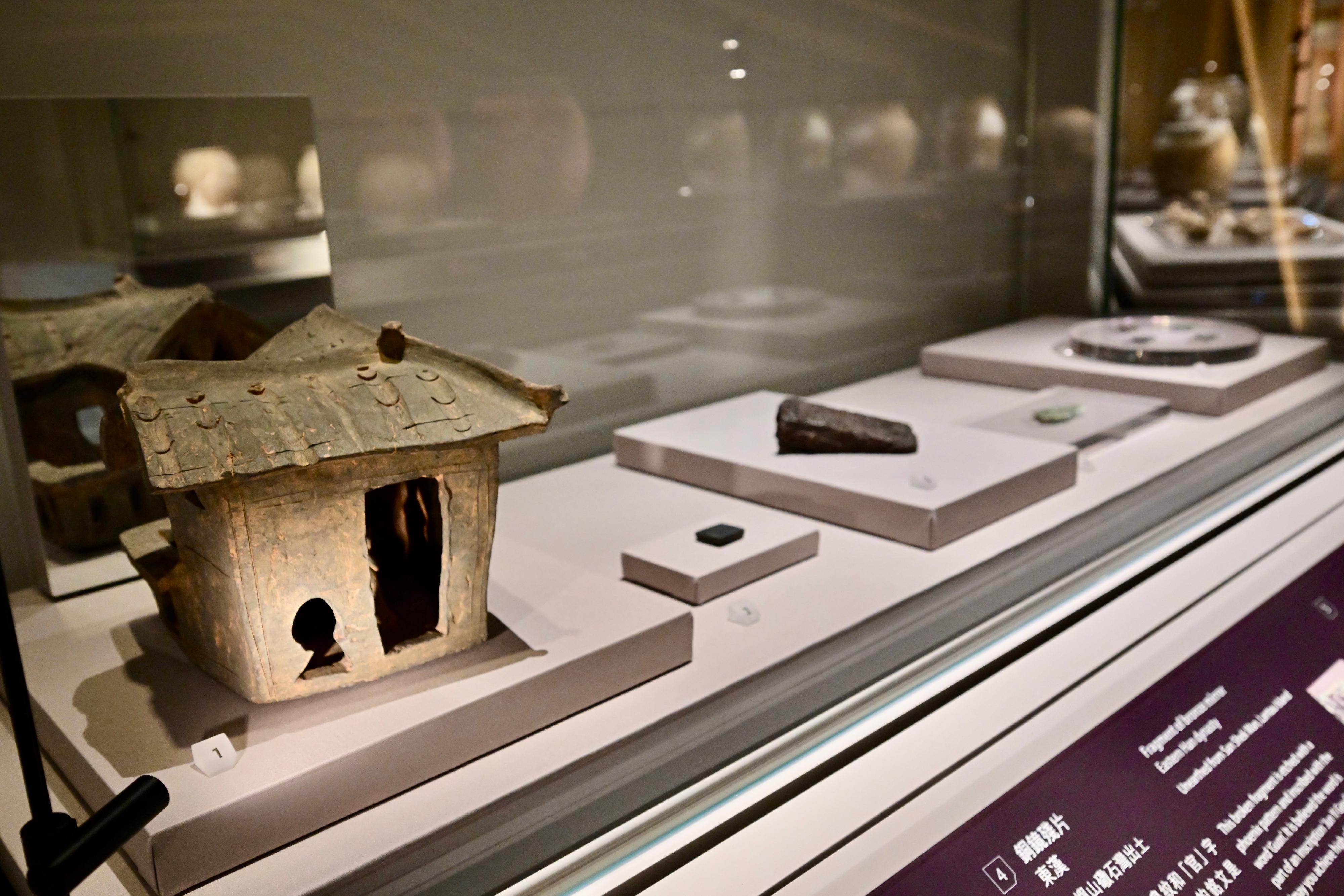 The Hong Kong Museum of History’s "The Hong Kong Jockey Club Series: The Great Unity - Civilisation of the Qin and Han Dynasties in Shaanxi Province" exhibition will be open to the public from tomorrow (April 16). Photo shows archeological finds of the Han dynasty from Hong Kong, including a pottery model of a house unearthed from Lei Cheng Uk Han Tomb and a fragment of bronze mirror unearthed from San Shek Wan, Lantau Island; Wuzhu bronze coins unearthed from So Kwun Wat, Tuen Mun, Sham Wan, Lamma Island and Sham Wan Tsuen, Chek Lap Kok; and Daquan Wushi bronze coins unearthed from Tung Wan Tsai, Ma Wan.
