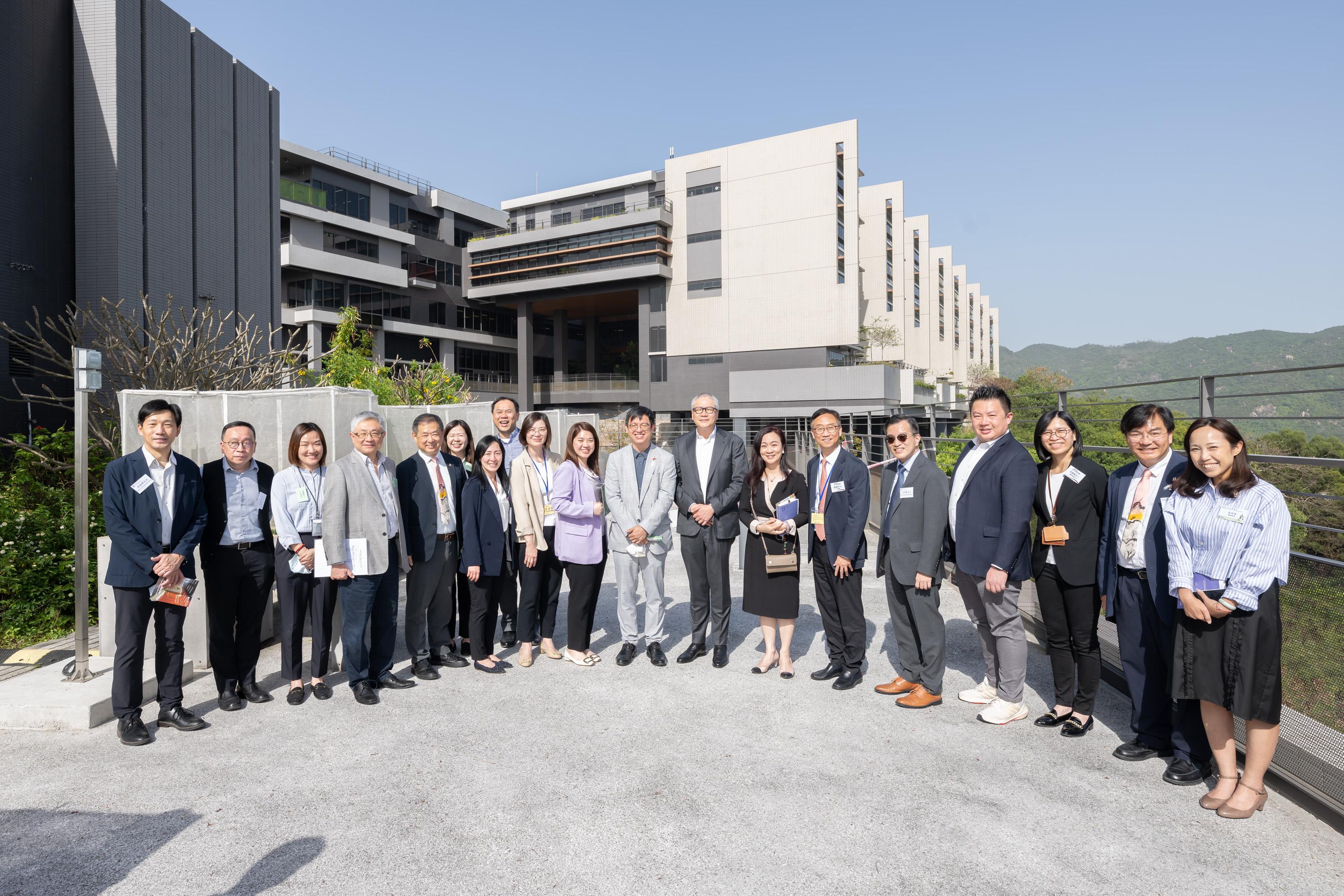 The Legislative Council (LegCo) Panel on Welfare Services and Subcommittee on Issues Relating to the Support for Persons with Disabilities conducted a joint visit to the Siu Lam Integrated Rehabilitation Services Complex today (April 15) to understand its operation since the opening. The Chairman of the Panel on Welfare Services, Reverend Canon Peter Douglas Koon (eighth right), the Chairman of the Subcommittee on Issues Relating to the Support for Persons with Disabilities, Ms Lam So-wai (tenth left), and other LegCo Members pose for a group photo with Under Secretary for Labour and Welfare, Mr Ho Kai-ming (ninth right) and the representatives of the Social Welfare Department and the three operators at the Complex.